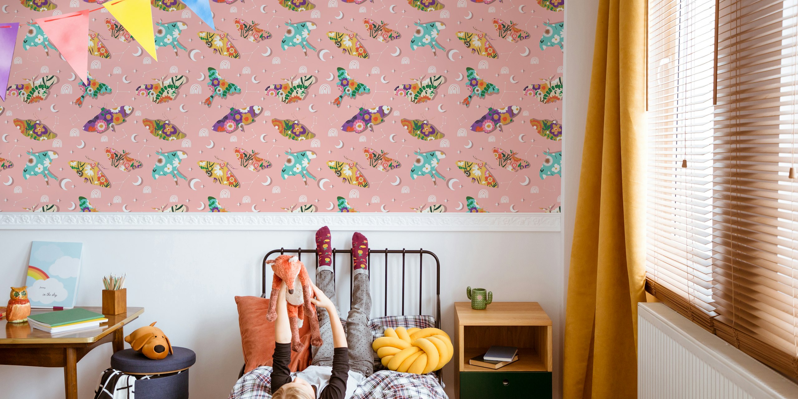 Colorful butterflies and crescent moons on pink background wallpaper