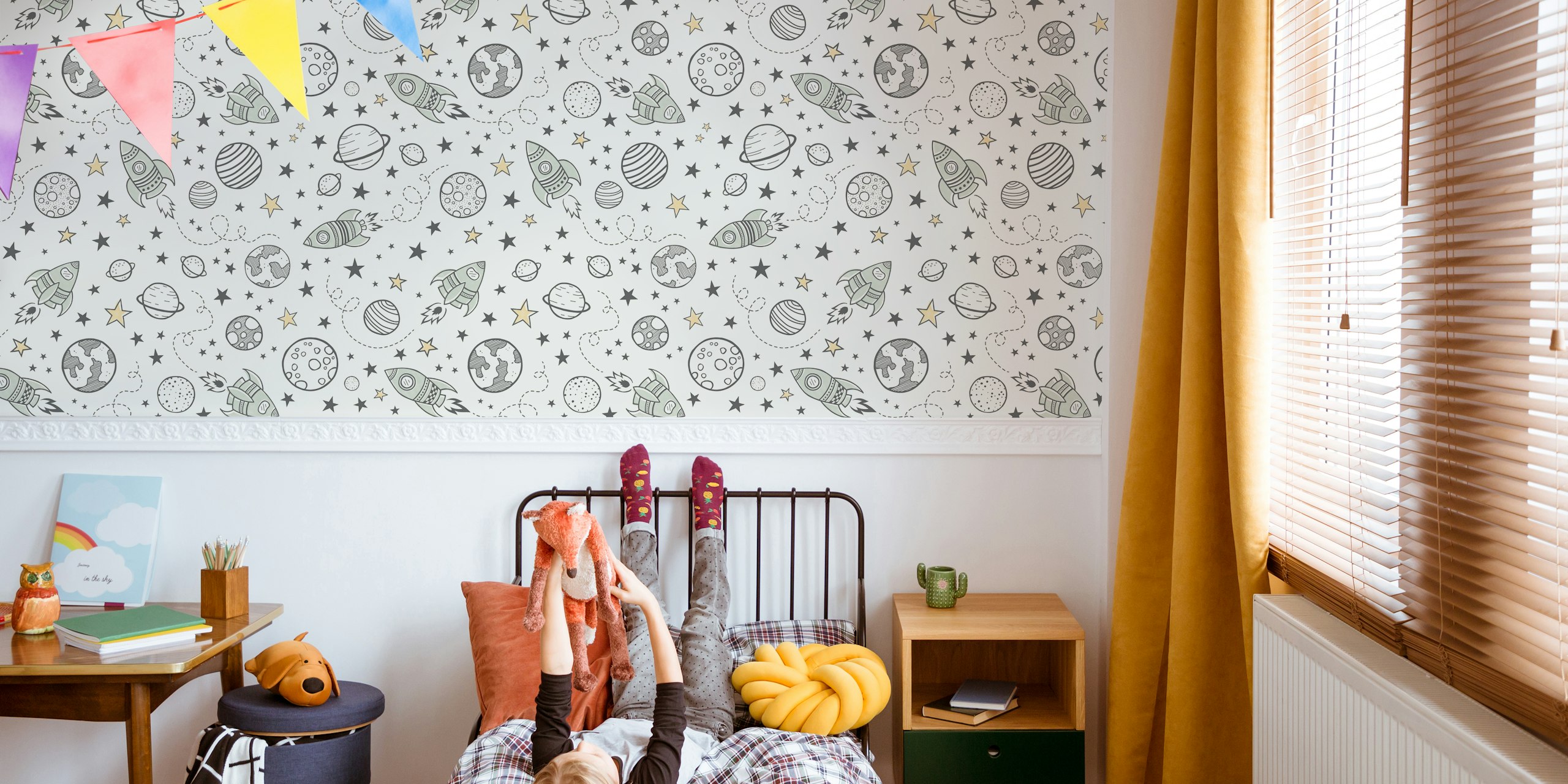 Whimsical rocket wallpaper design in a room