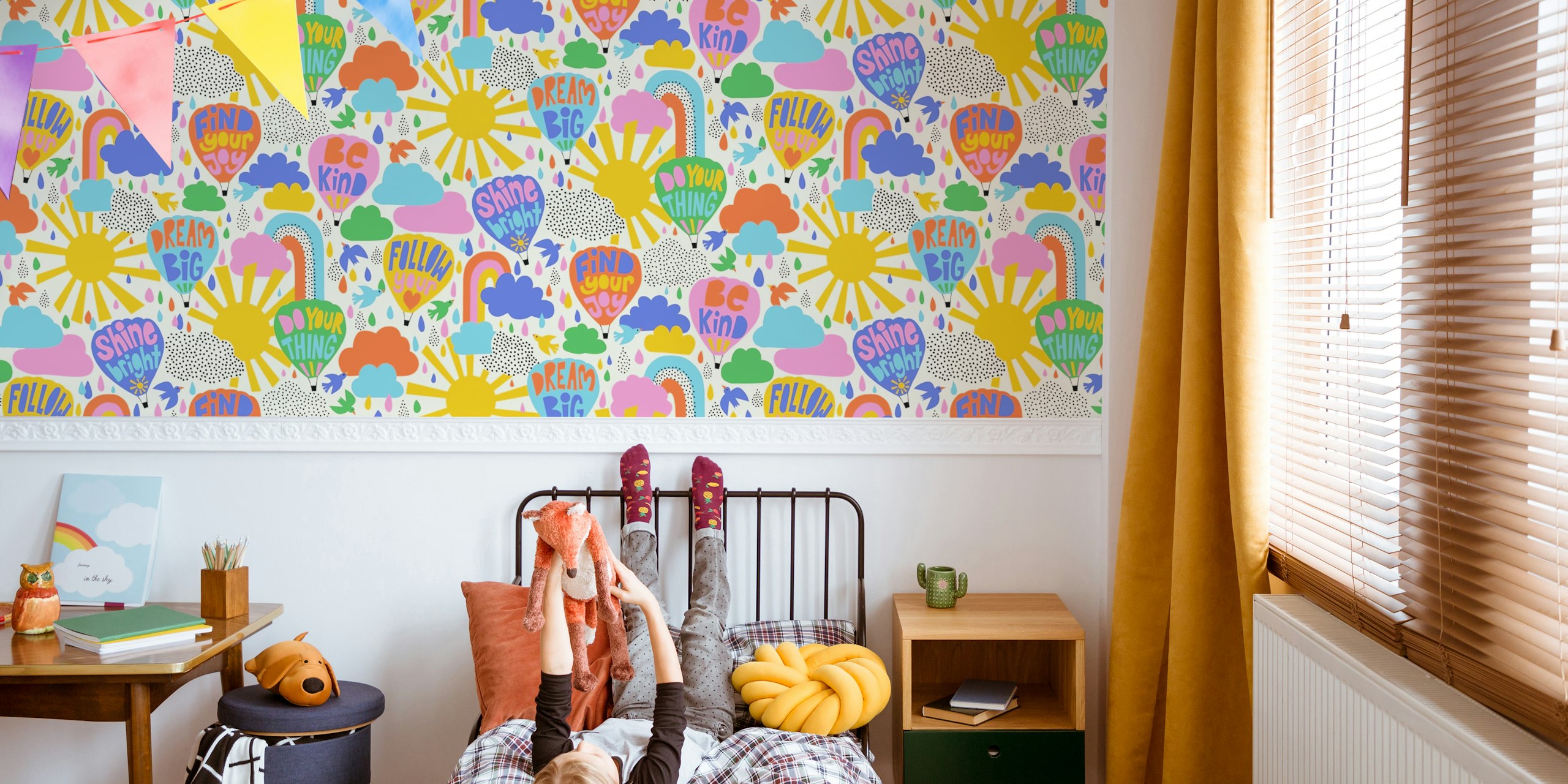 Colorful hot air balloons and cheerful messages in pink, blue, yellow on cream wallpaper