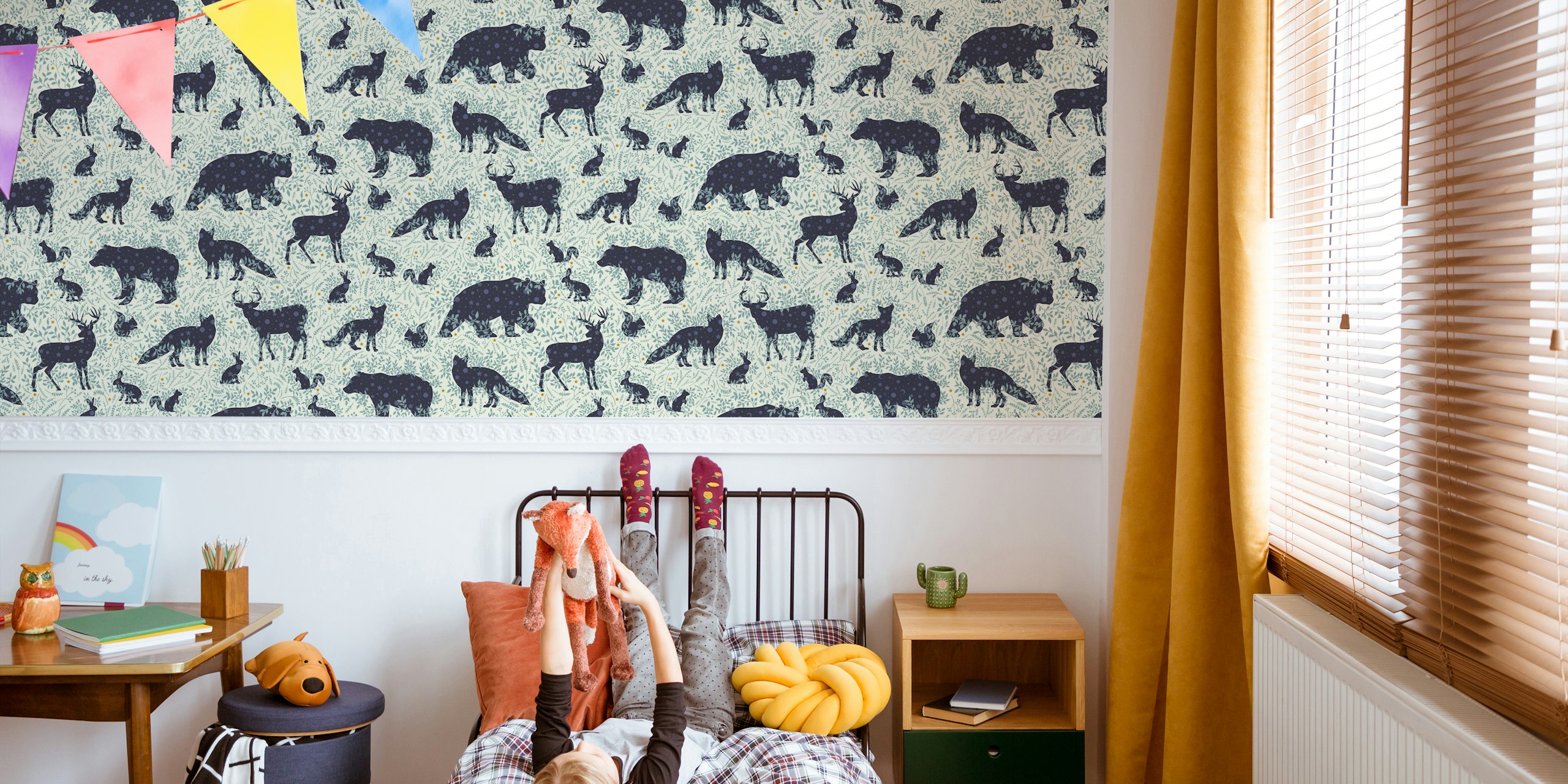 Whimsical woodland creatures wallpaper in a room