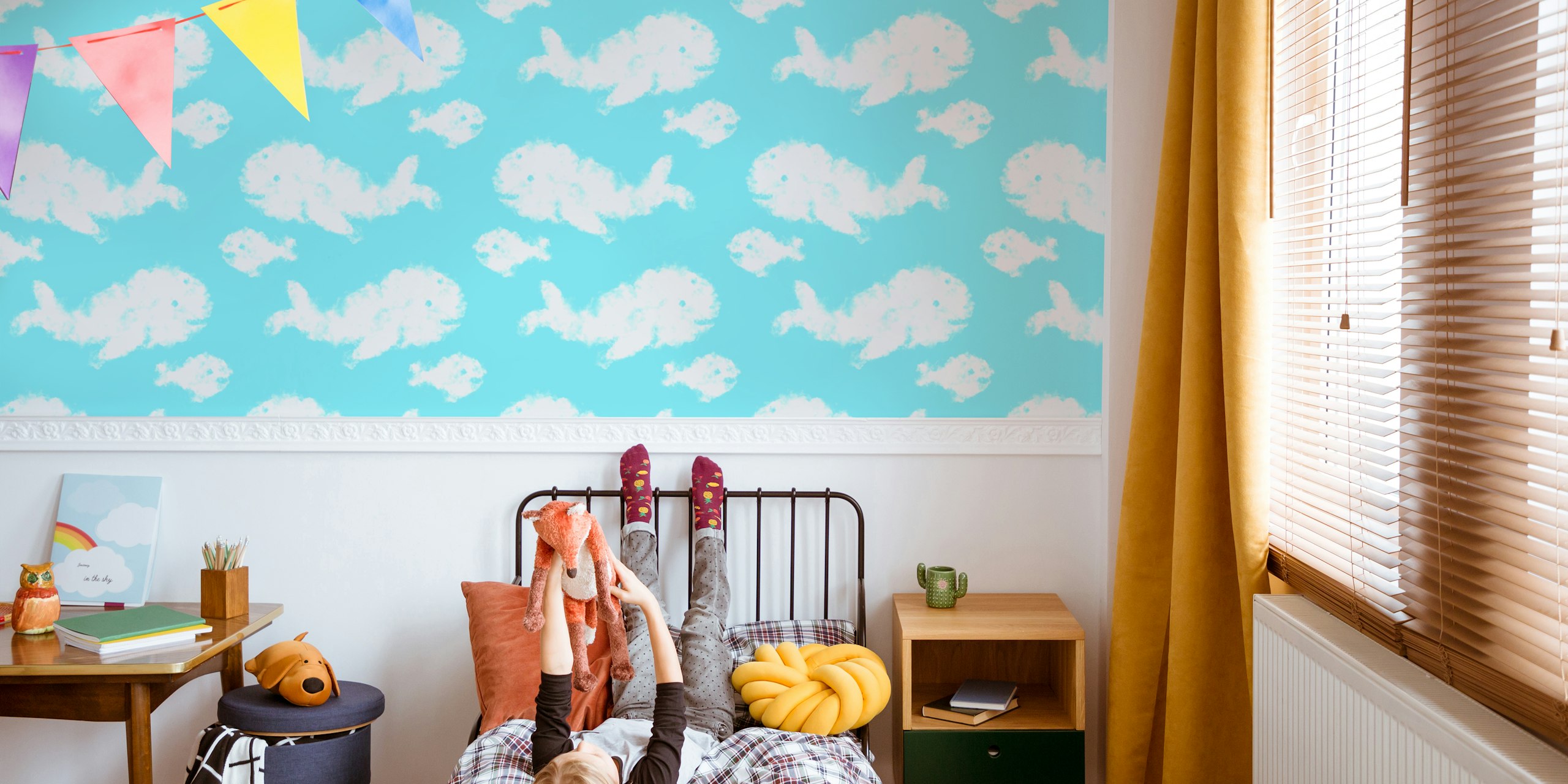 Illustrative whales shaped as clouds on a sky-blue background wall mural