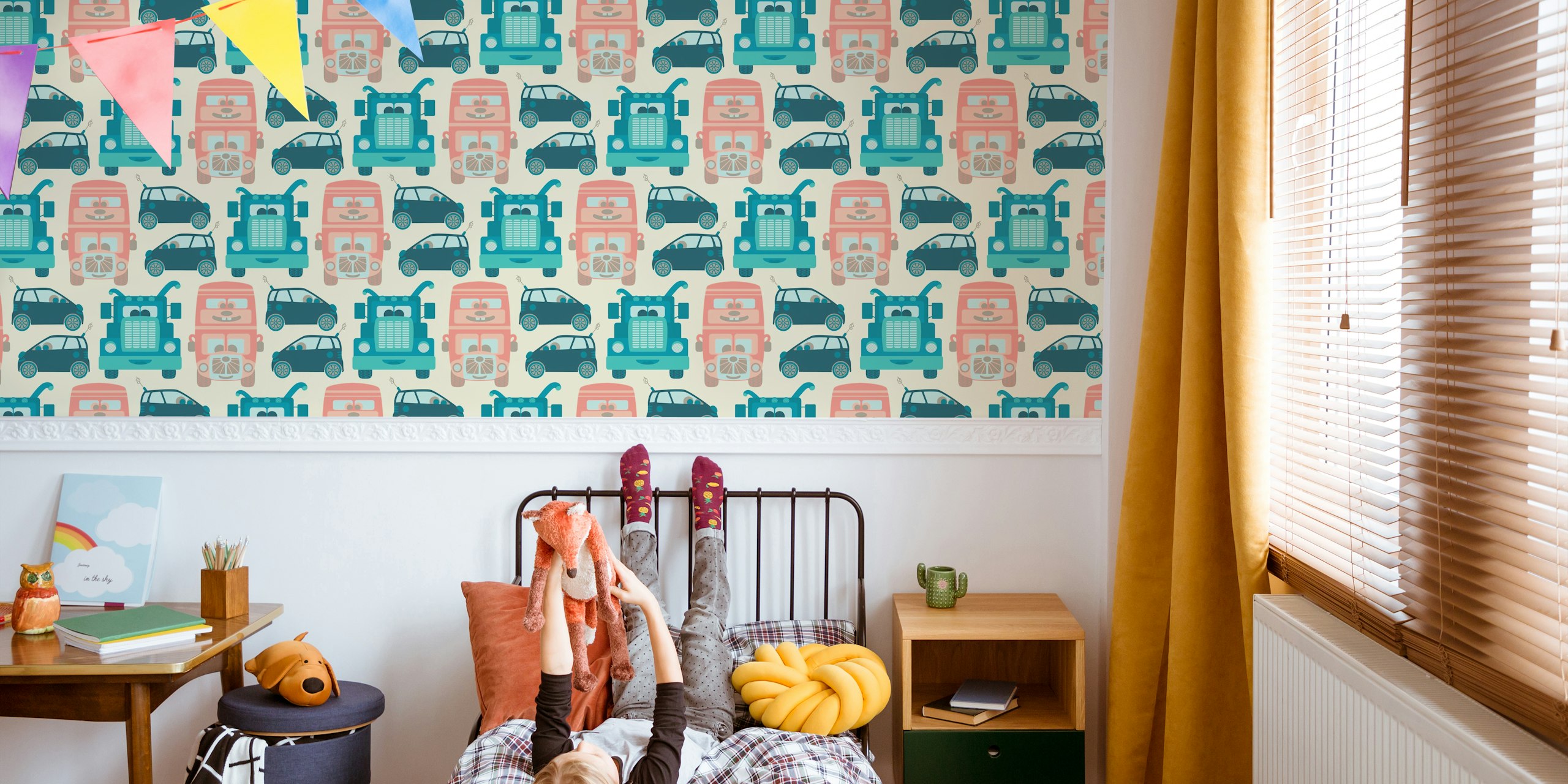 Colorful kids wall mural with vintage-style illustrated trucks, cars, and buses in pastel shades.