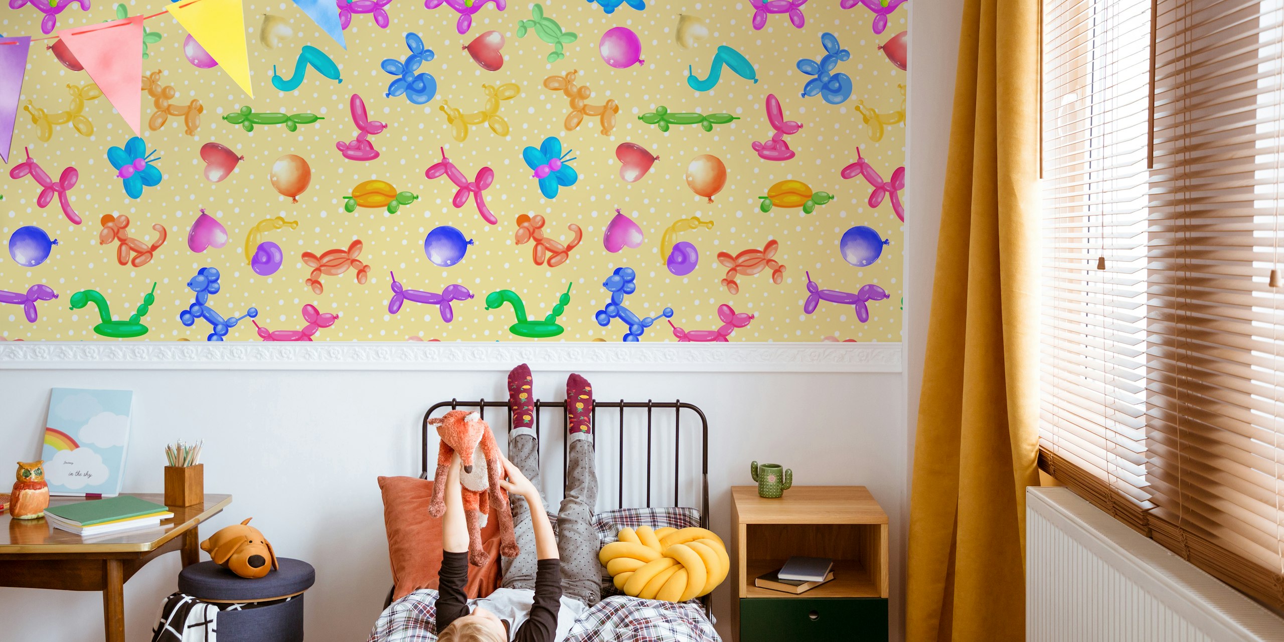 Colorful balloon animals and polka dots on yellow background wallpaper