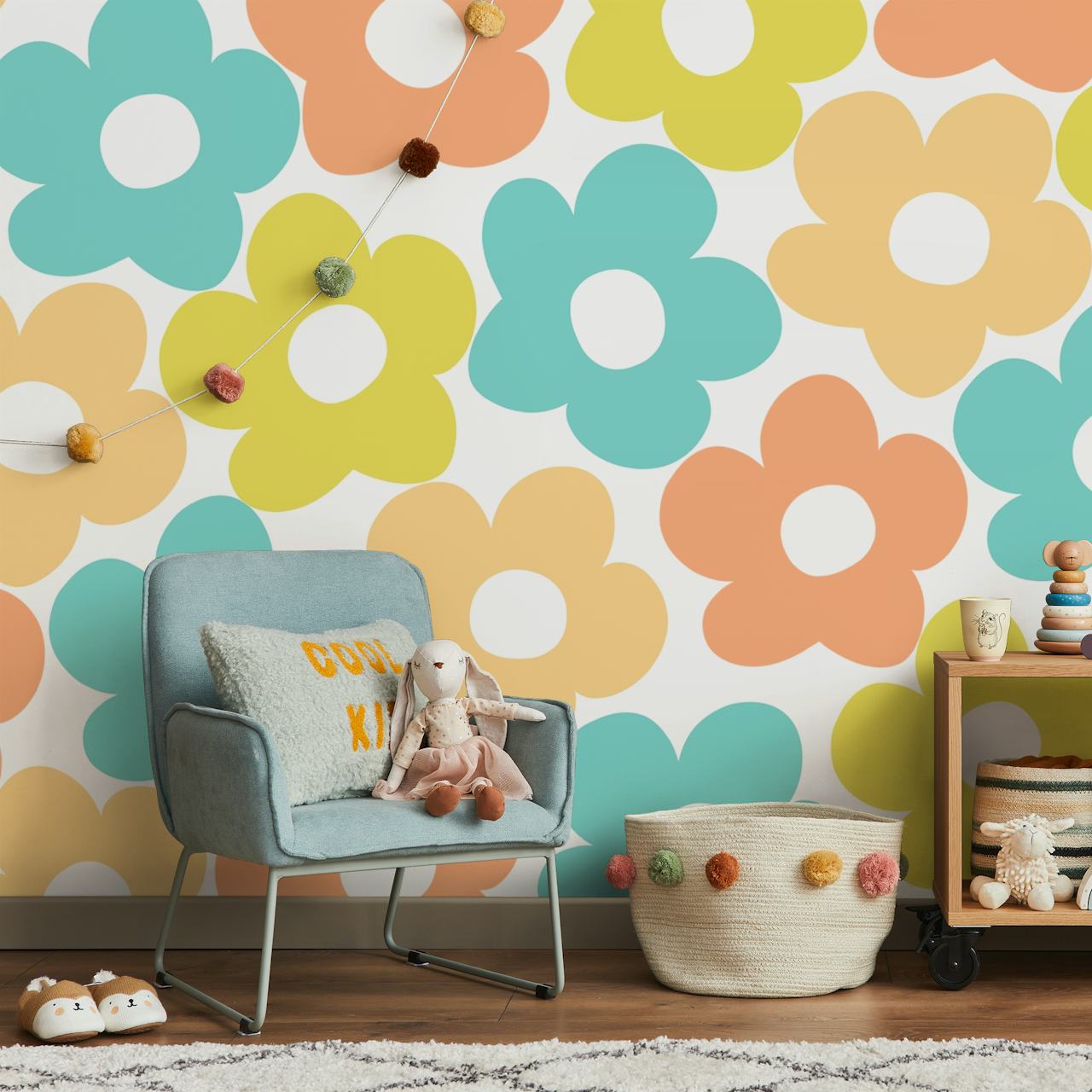 Colorful retro floral wallpaper with pastel flowers in blue, pink, yellow, and peach.