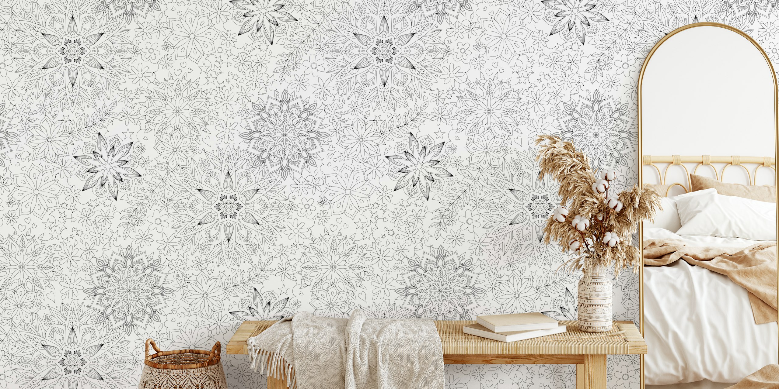 Floral mandala patterns in black and white wallpaper.