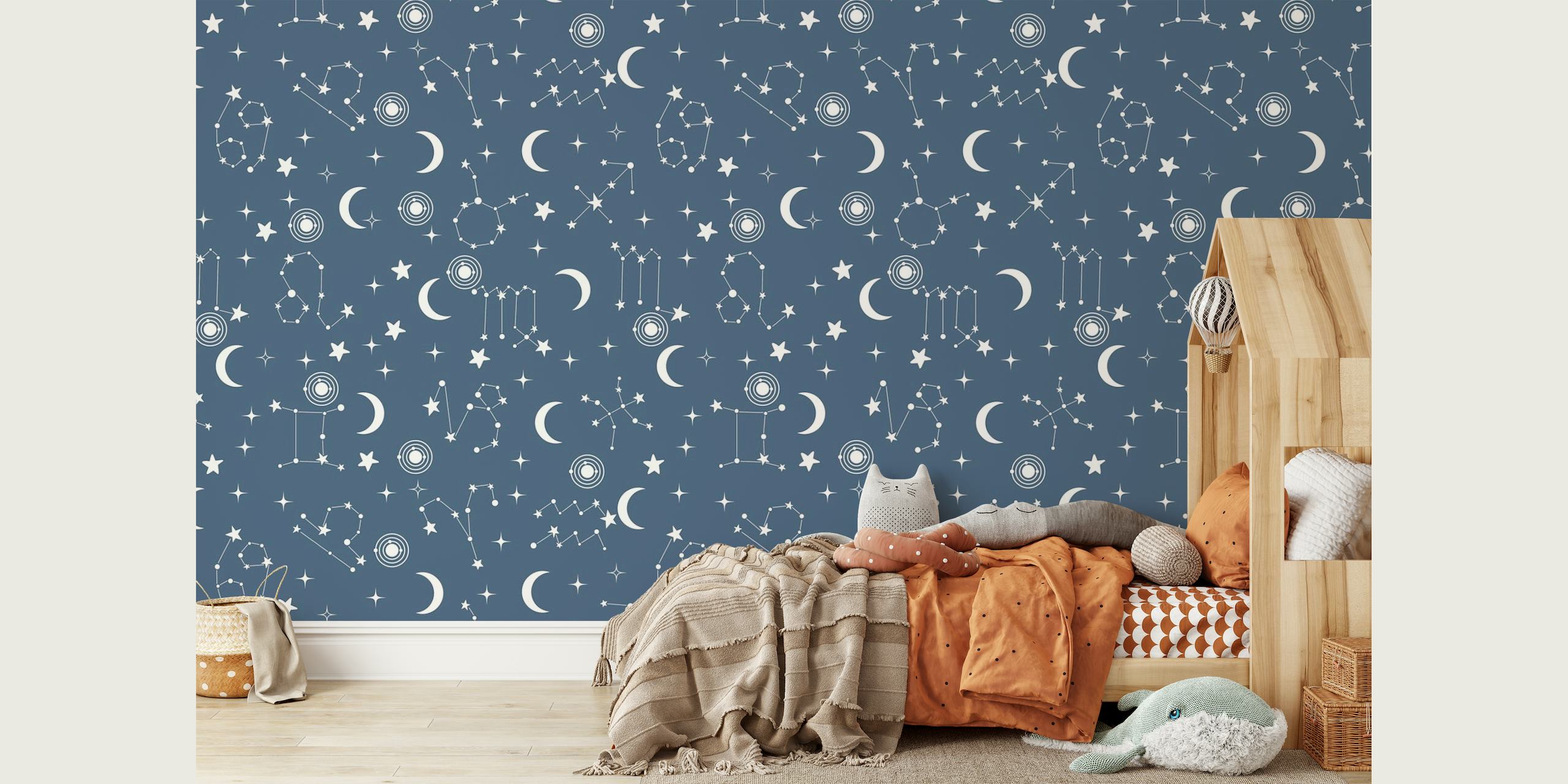 A blue wall mural featuring a pattern of stars and constellations