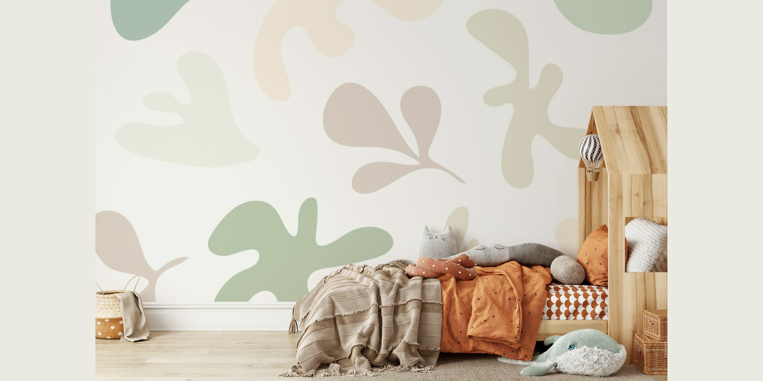 Formas abstractas de color verde suave y patrones de follaje en un mural de pared