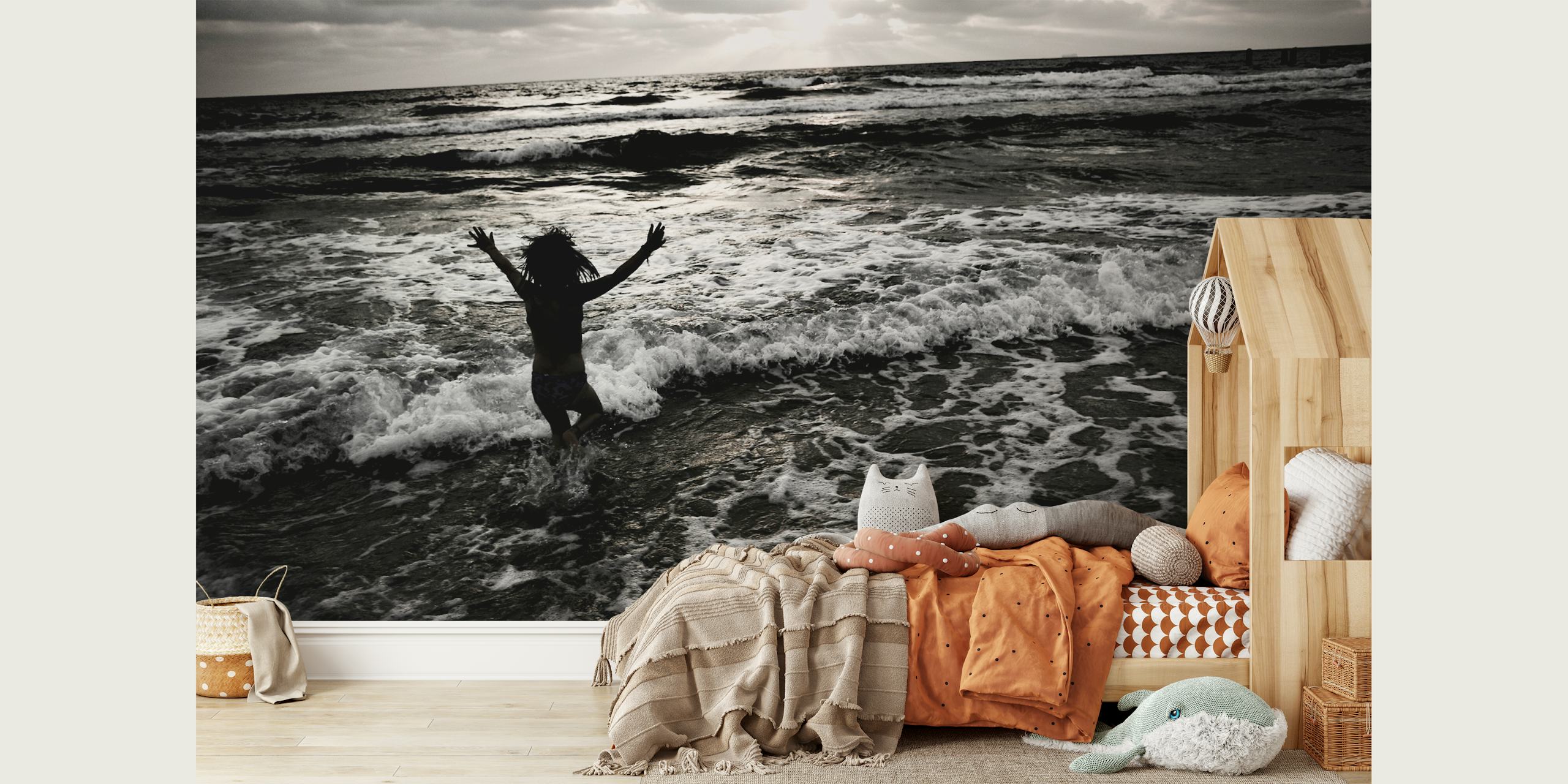 Person jumping in the ocean with waves crashing around, black and white wallpaper