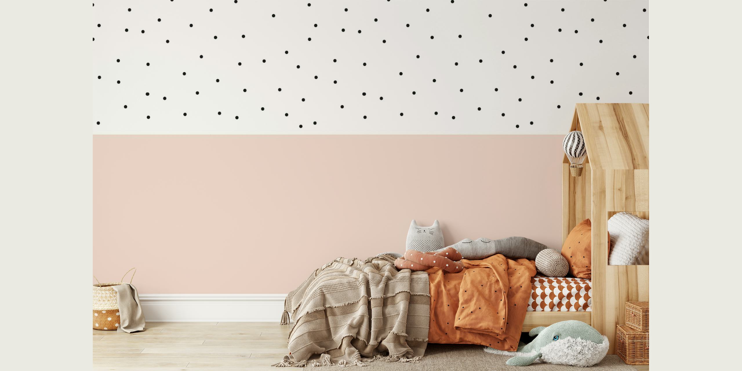 Soft pink wall mural with black polka dots