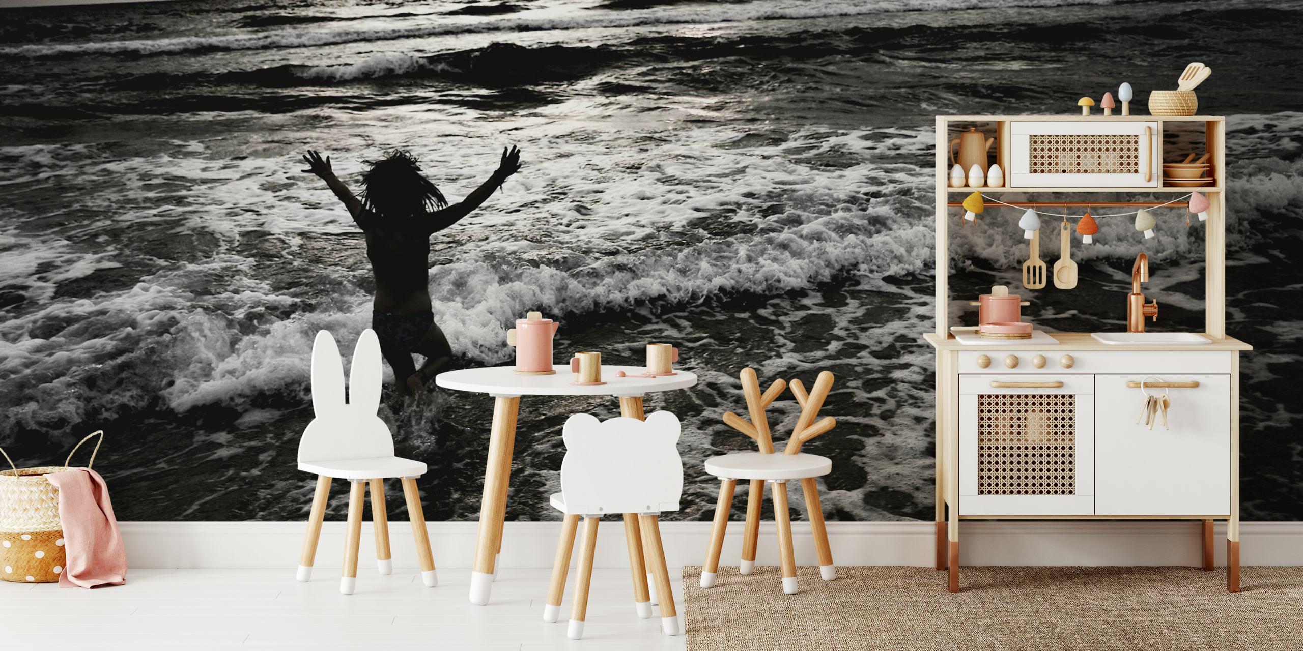 Person jumping in the ocean with waves crashing around, black and white wallpaper