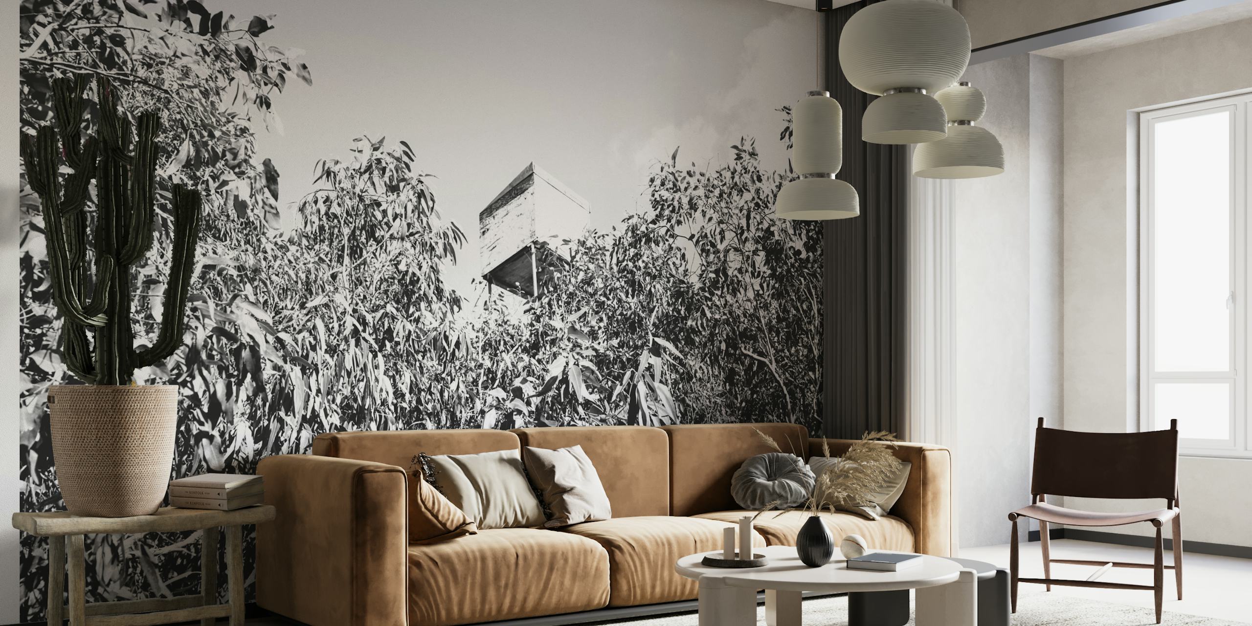 Black and white wall mural of a tree house amidst dense forest foliage