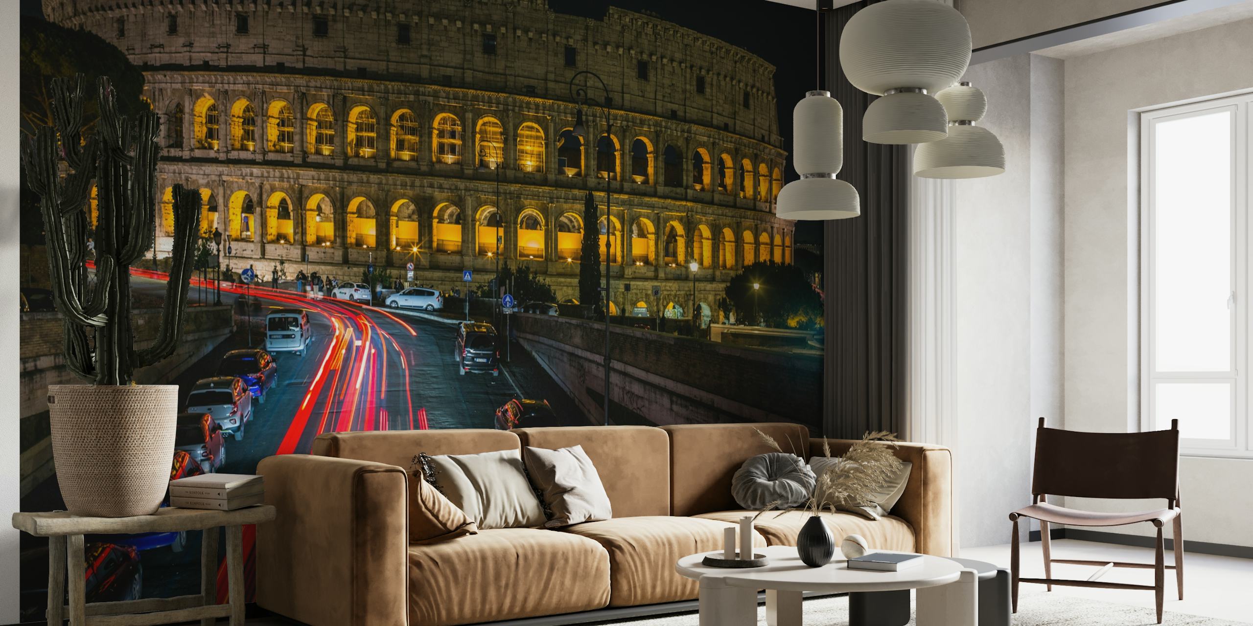 Colosseum yöllä seinämaalaus, jossa on valaistuja kaaria ja liikennejuovia