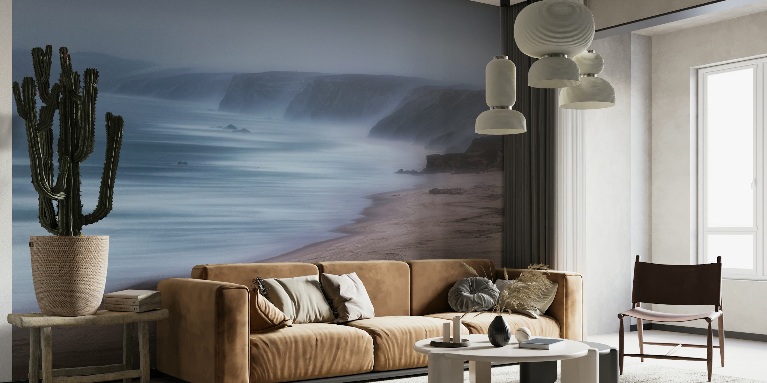 Misty beach and ocean wall mural with soft blues and neutral tones