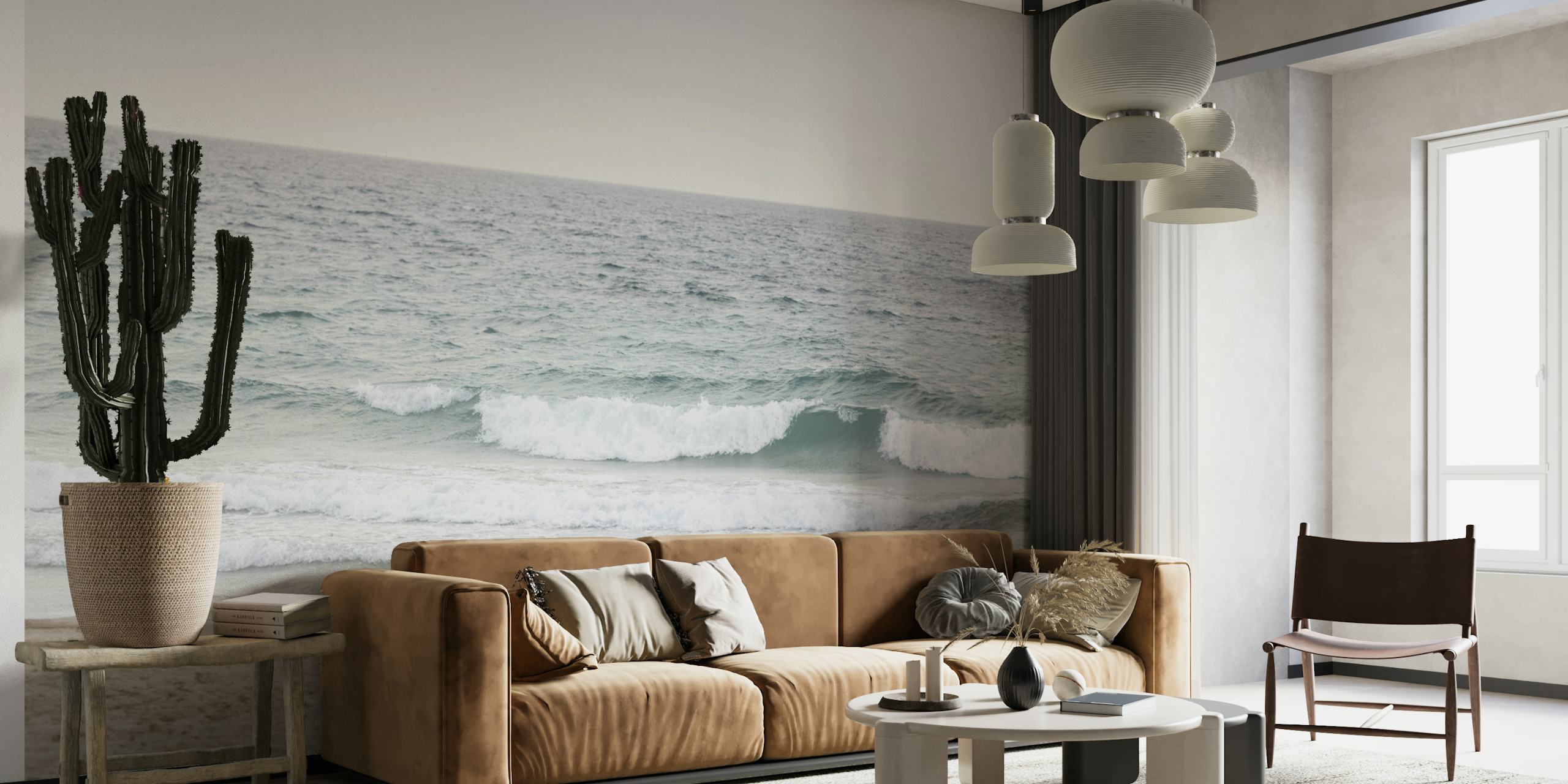 Ocean waves on a beach with soft beige sand and blue water wallpaper