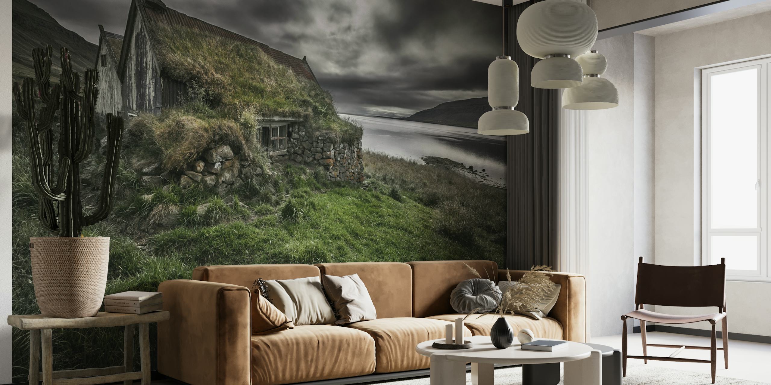 Stone cottage with grass roof in a dramatic landscape wall mural