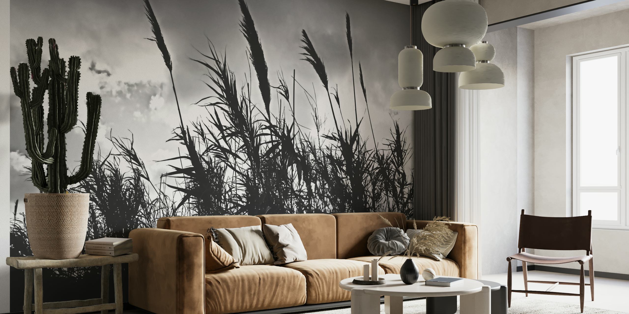 Black and white silhouette of tall wild grass against a cloudy sky wall mural