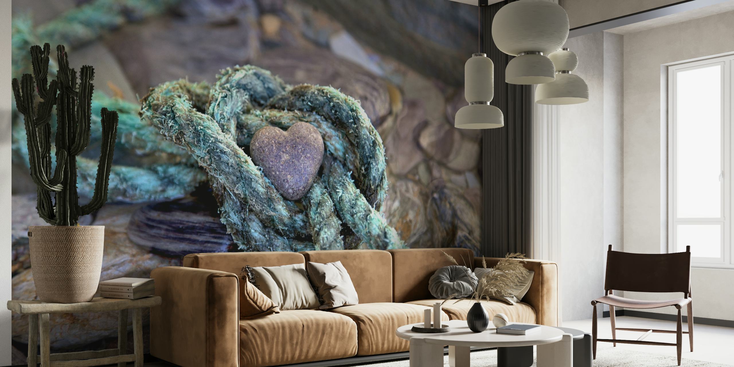 Rustic stone heart encircled by weathered rope on pebble background wall mural