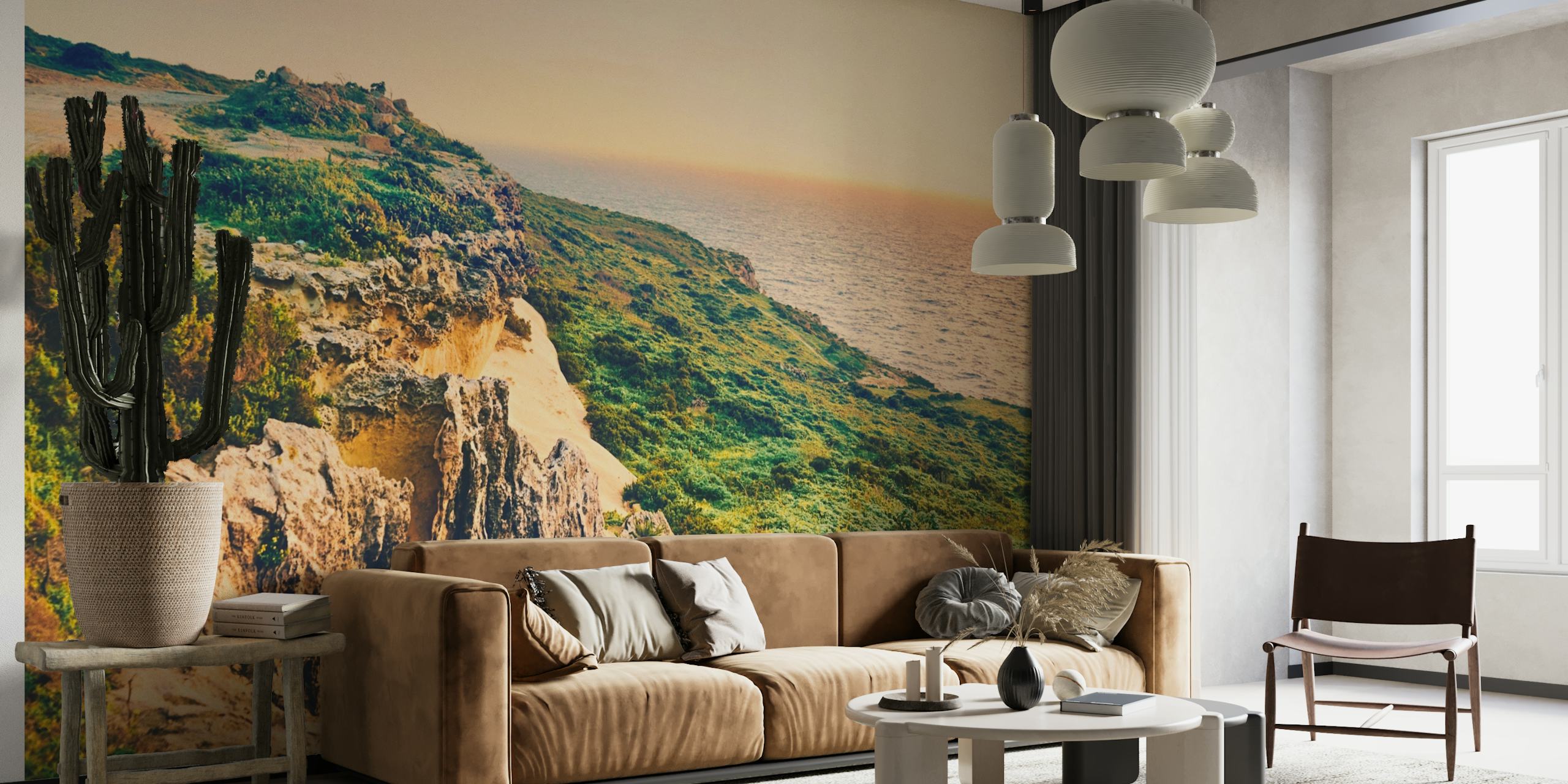 Ocean Sunset wall mural depicting the sun setting over a coastal landscape with cliffs and lush greenery