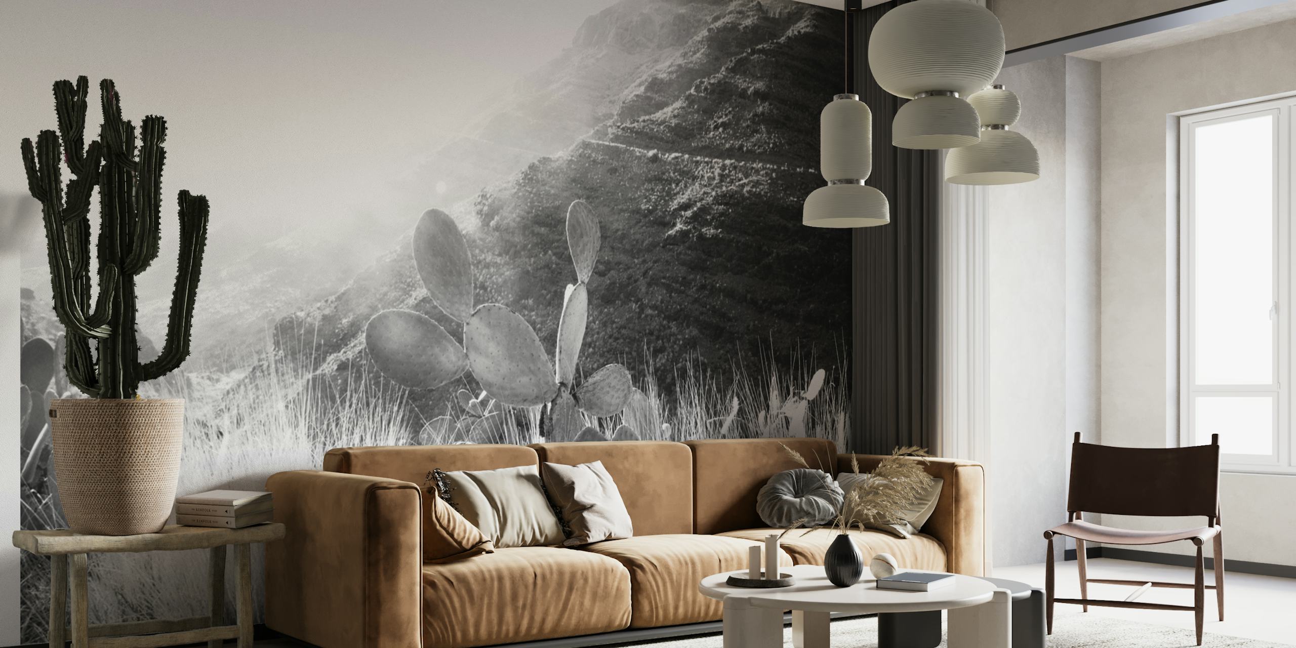 Yksivärinen kaktussiluetti vuoristotaustaa vasten