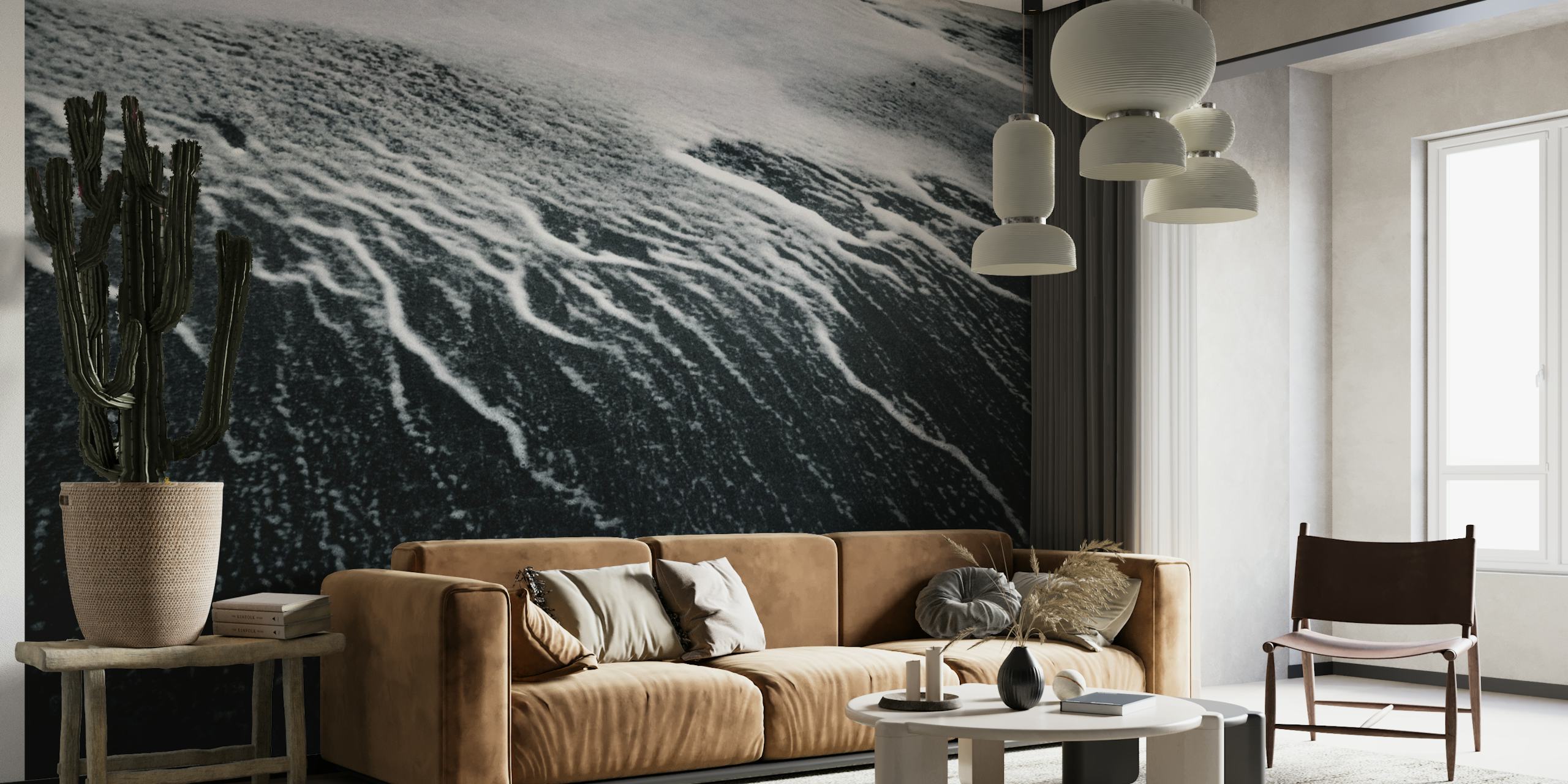Black and white close-up wall mural of wave patterns on sand depicting the remains of a wave