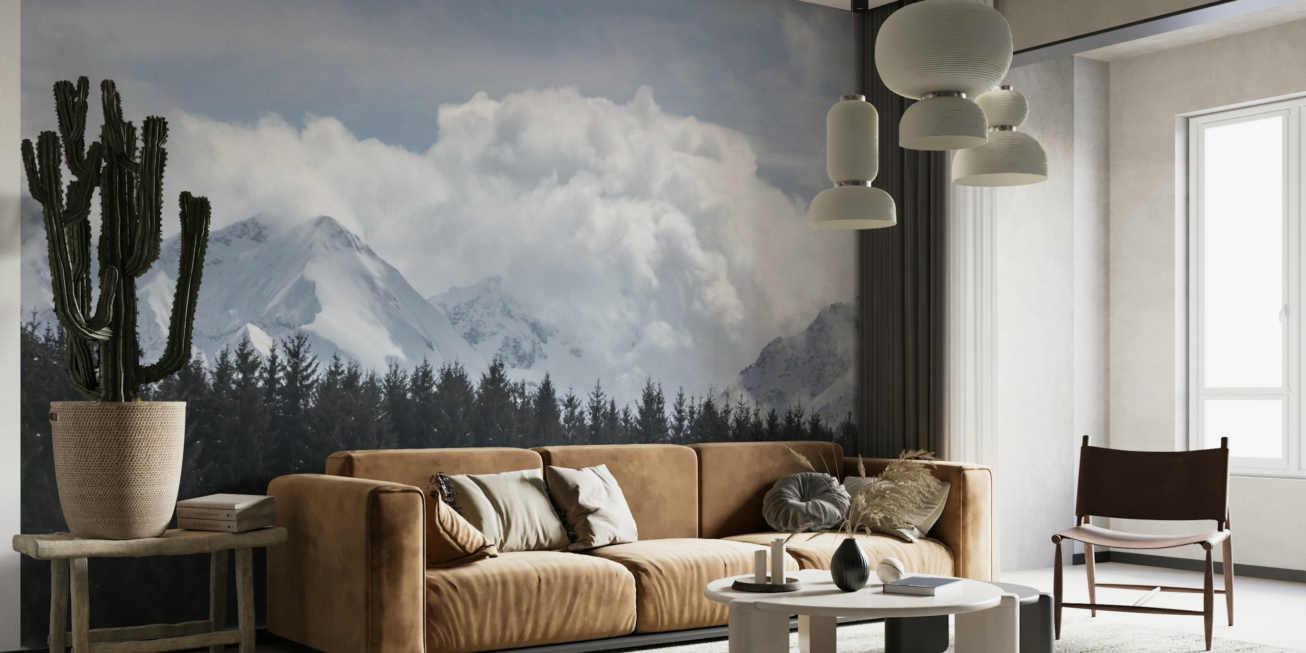 Snow-covered mountain peaks rising above a dark tree line wall mural