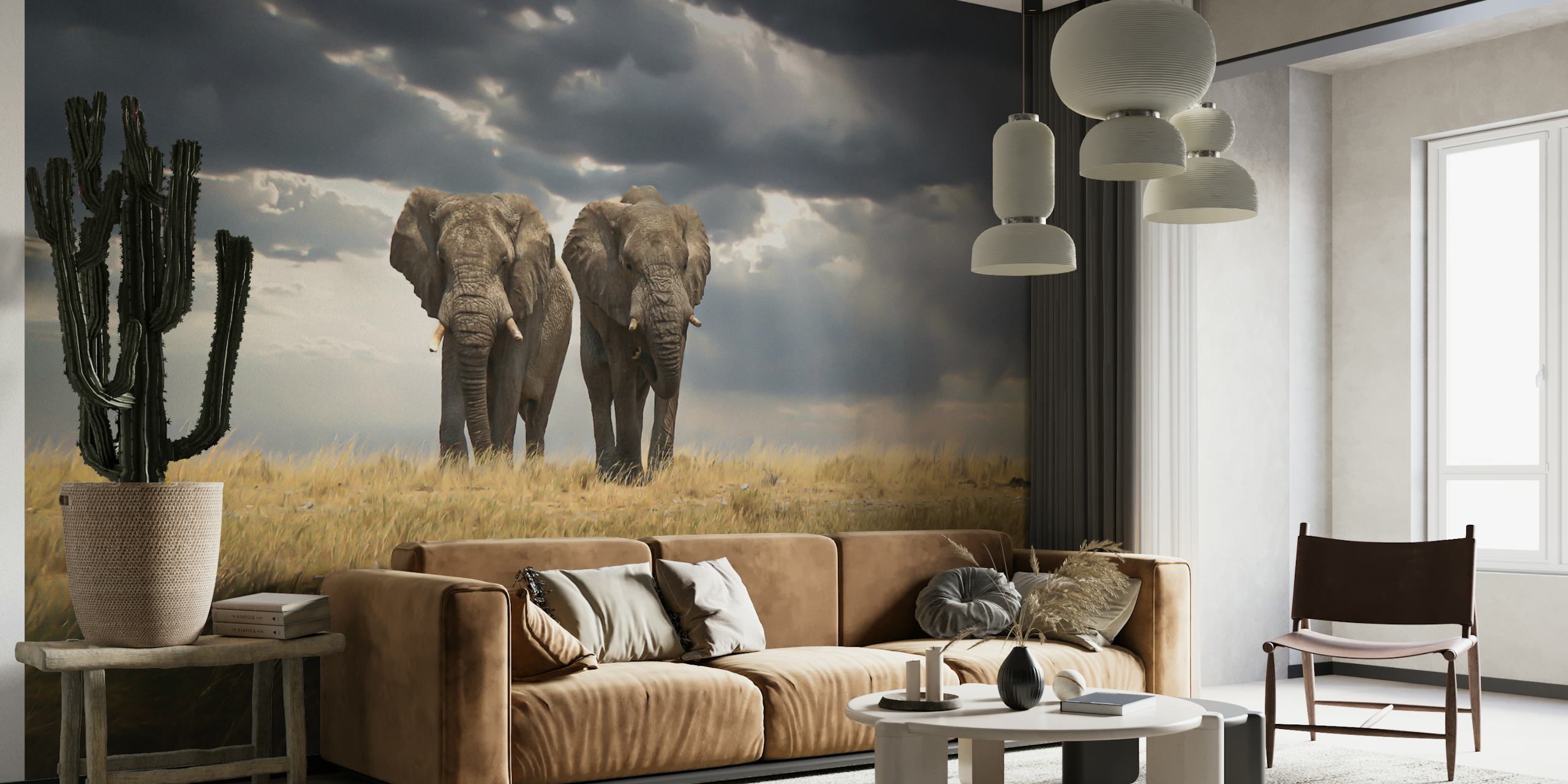 Elephants standing in a grassland under cloudy sky wallpaper