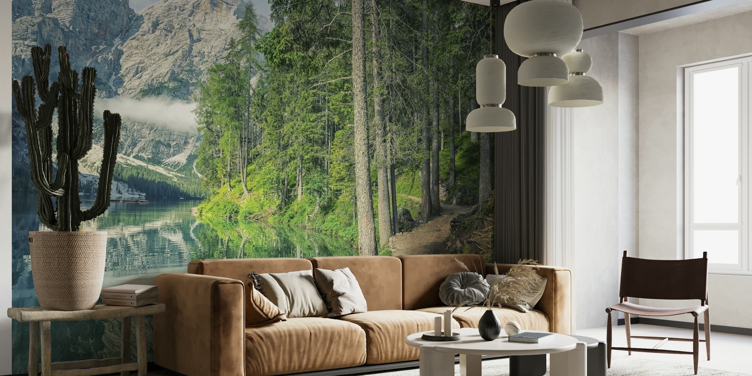 Tranquil lake scenery with a forest path leading towards mountains wall mural.
