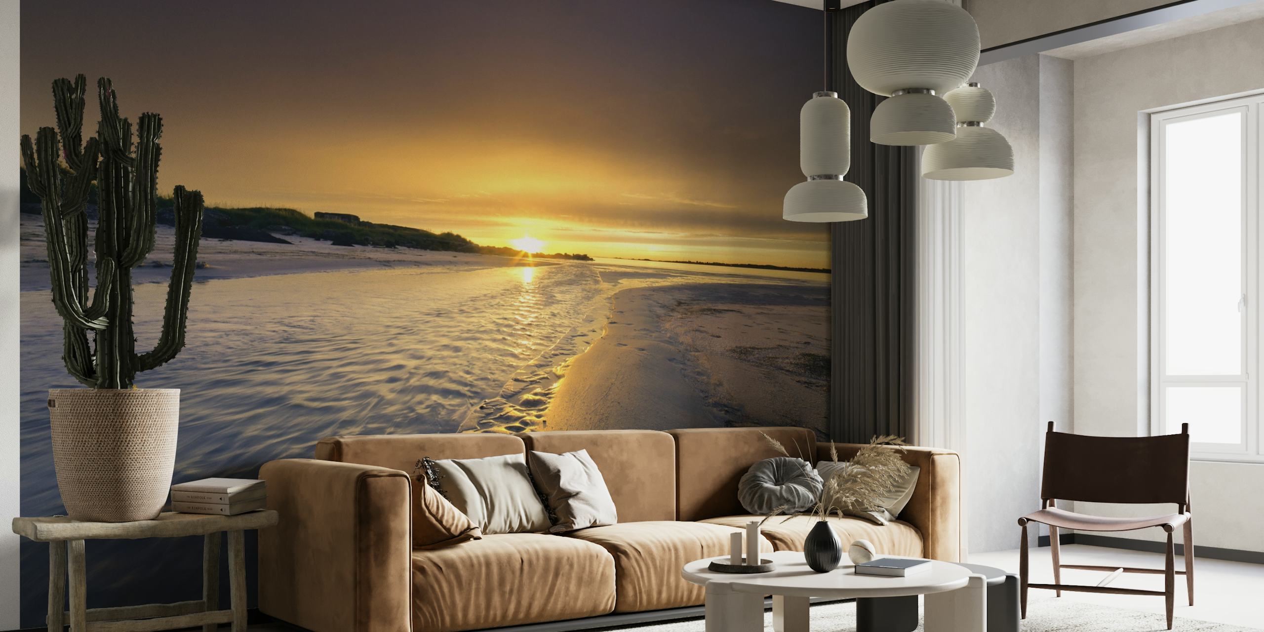 A tranquil beach scene at sunset with footprints in the sand wall mural.