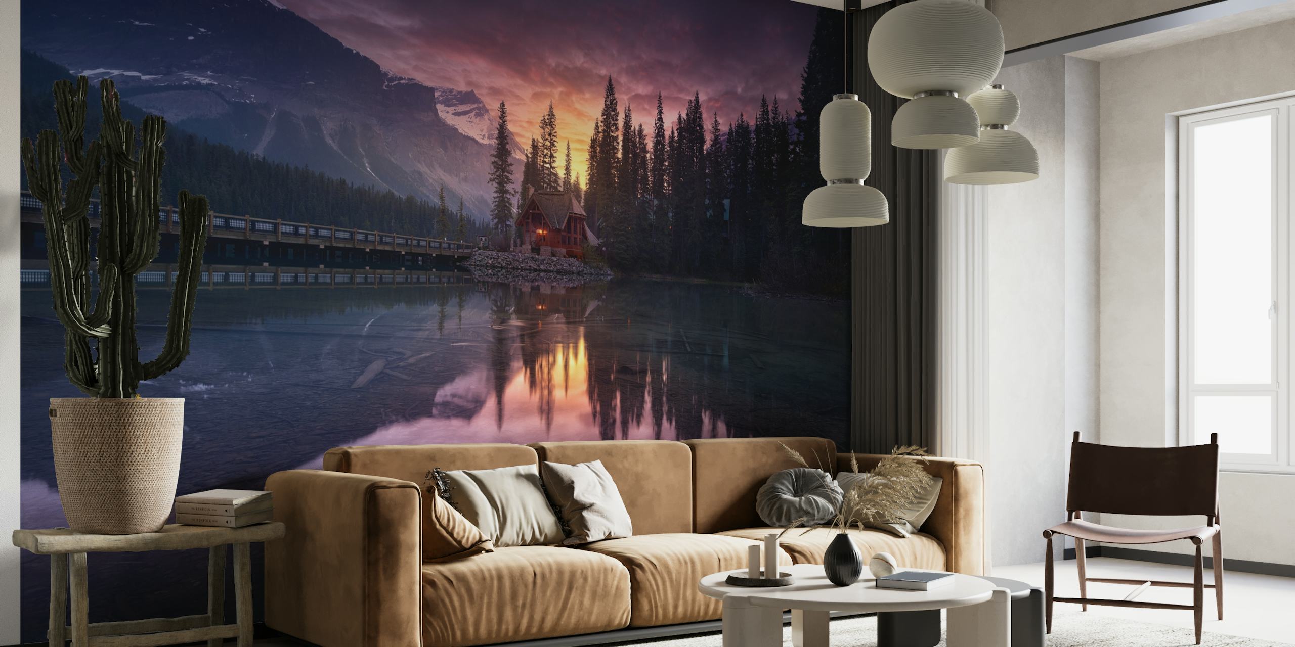 Serene sunrise over a lake with a cabin and mountains in the backdrop wall mural