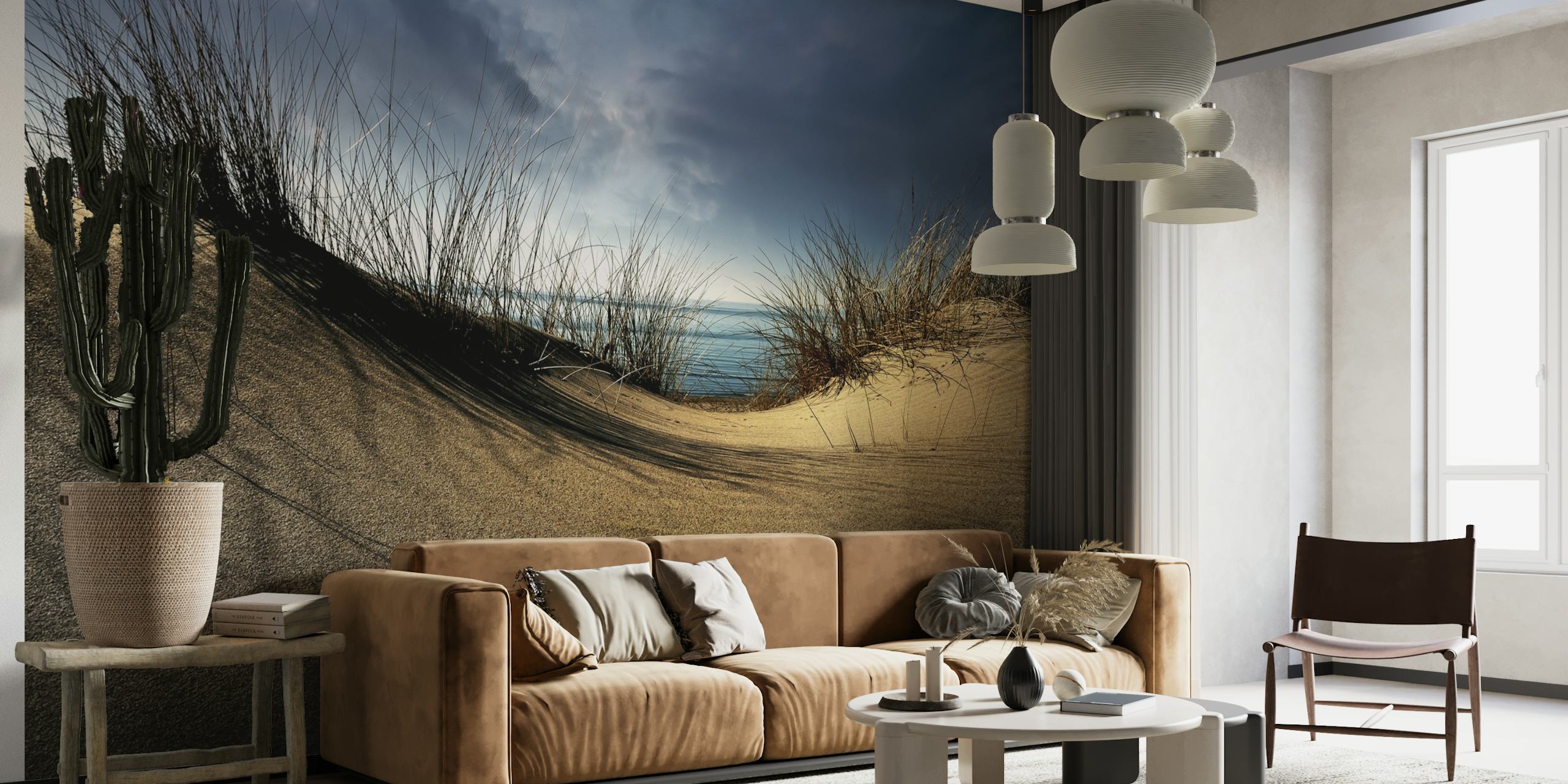 Coastal dunes with beige sand and grasses under a cloudy sky wallpaper