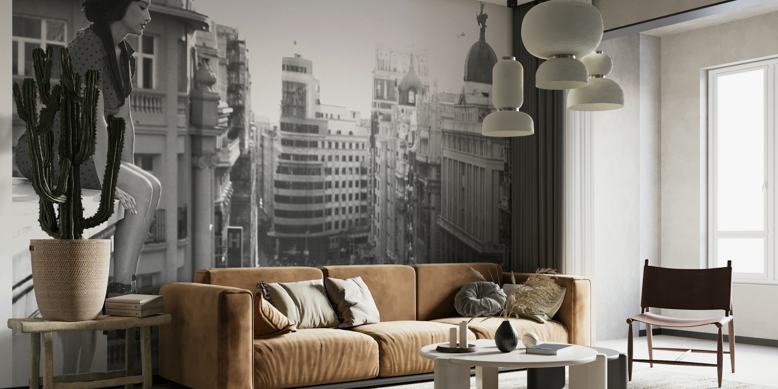 Black and white mural of a cityscape depicting Madrid's urban energy and historic buildings.