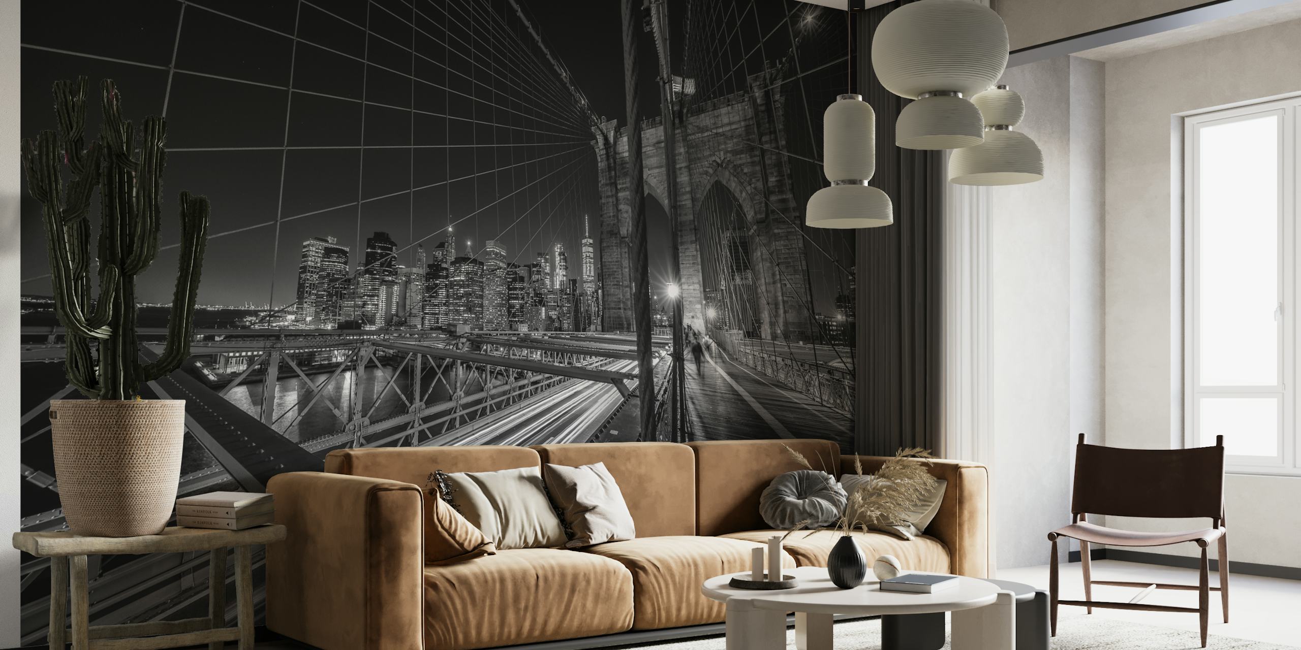 Black and white wall mural of the Brooklyn Bridge at night with city lights