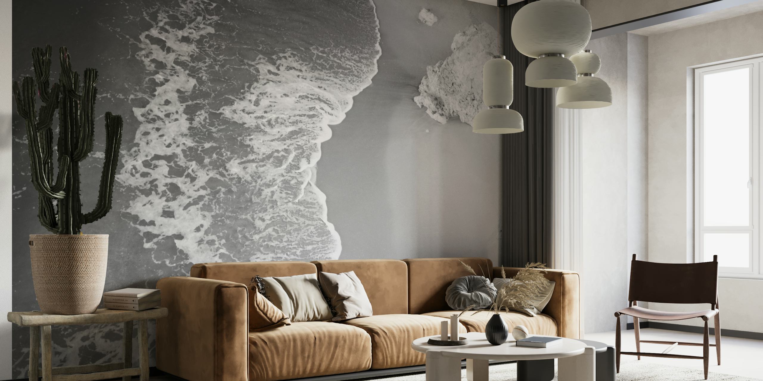 Black and white wall mural of Benagil Cave seashore with waves touching sand