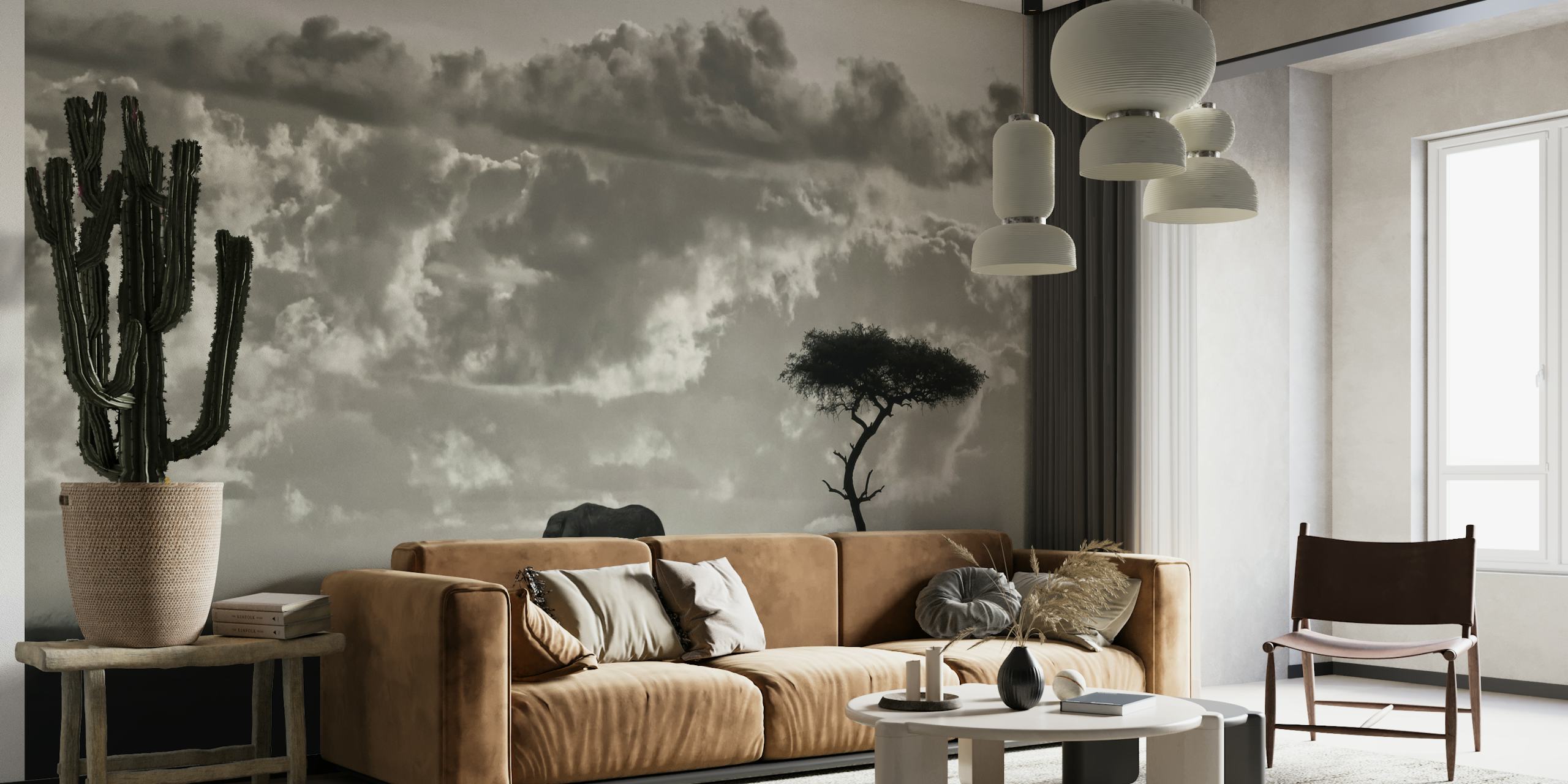 Black-and-white wall mural featuring elephant silhouettes on the African savannah under a dramatic sky