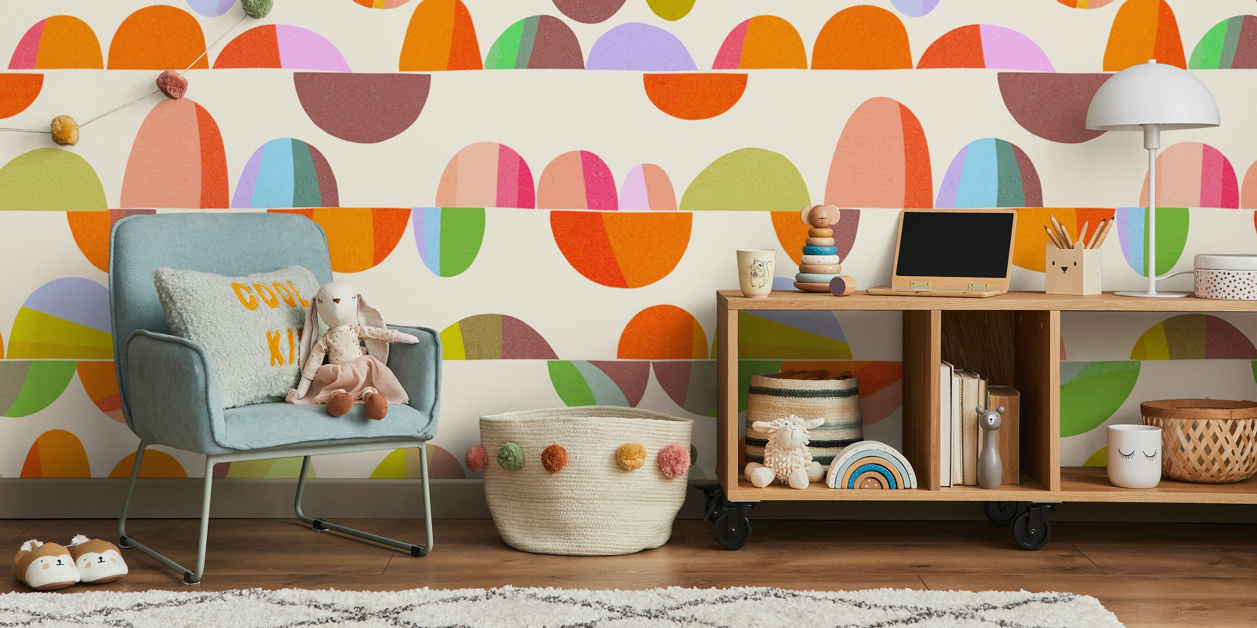 Colorful pebble shapes on pale background mid-century wallpaper