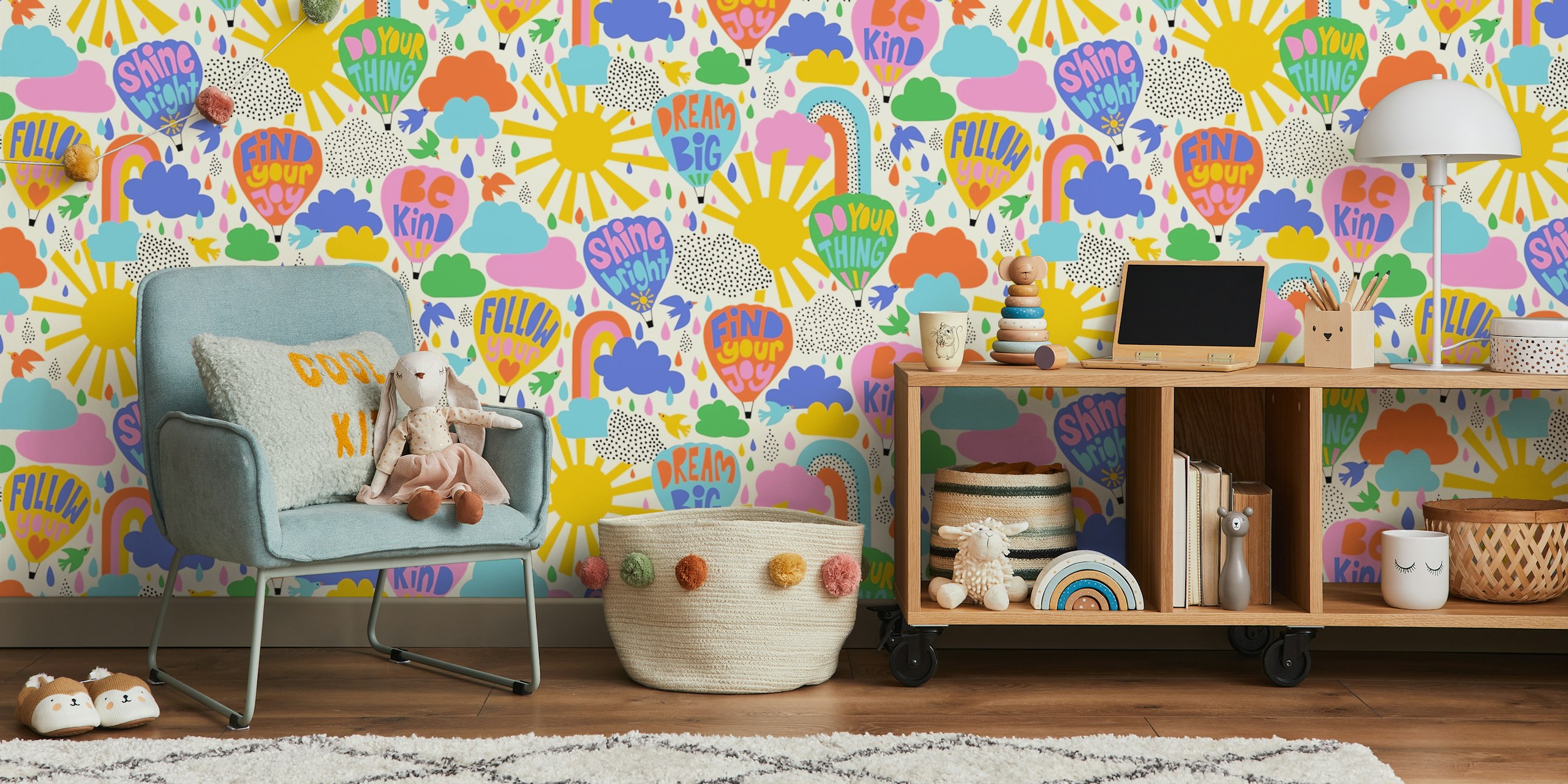 Colorful hot air balloons and cheerful messages in pink, blue, yellow on cream wallpaper