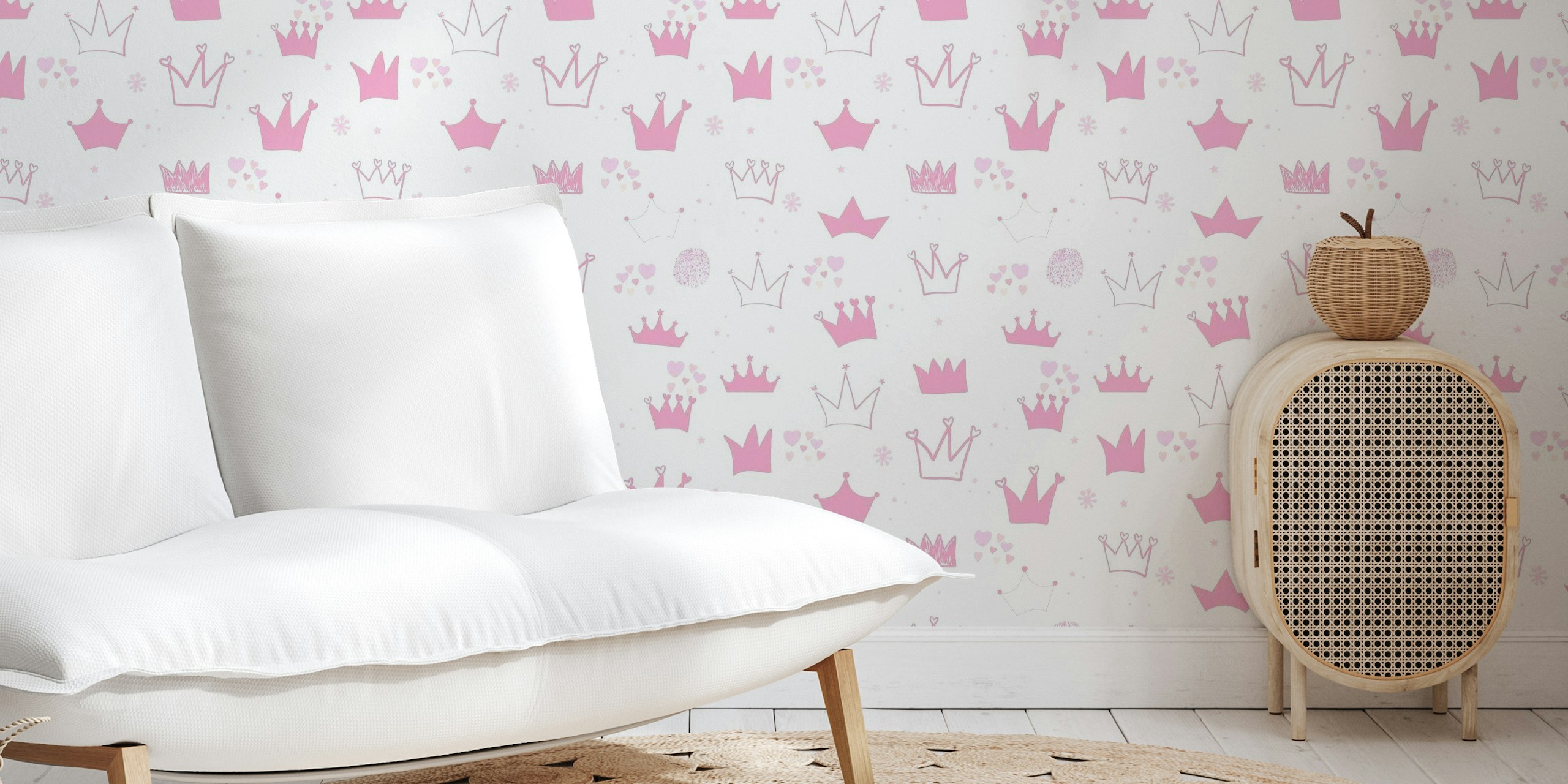 Hand-drawn crowns and hearts pattern wall mural in pink hues for a baby girl's room