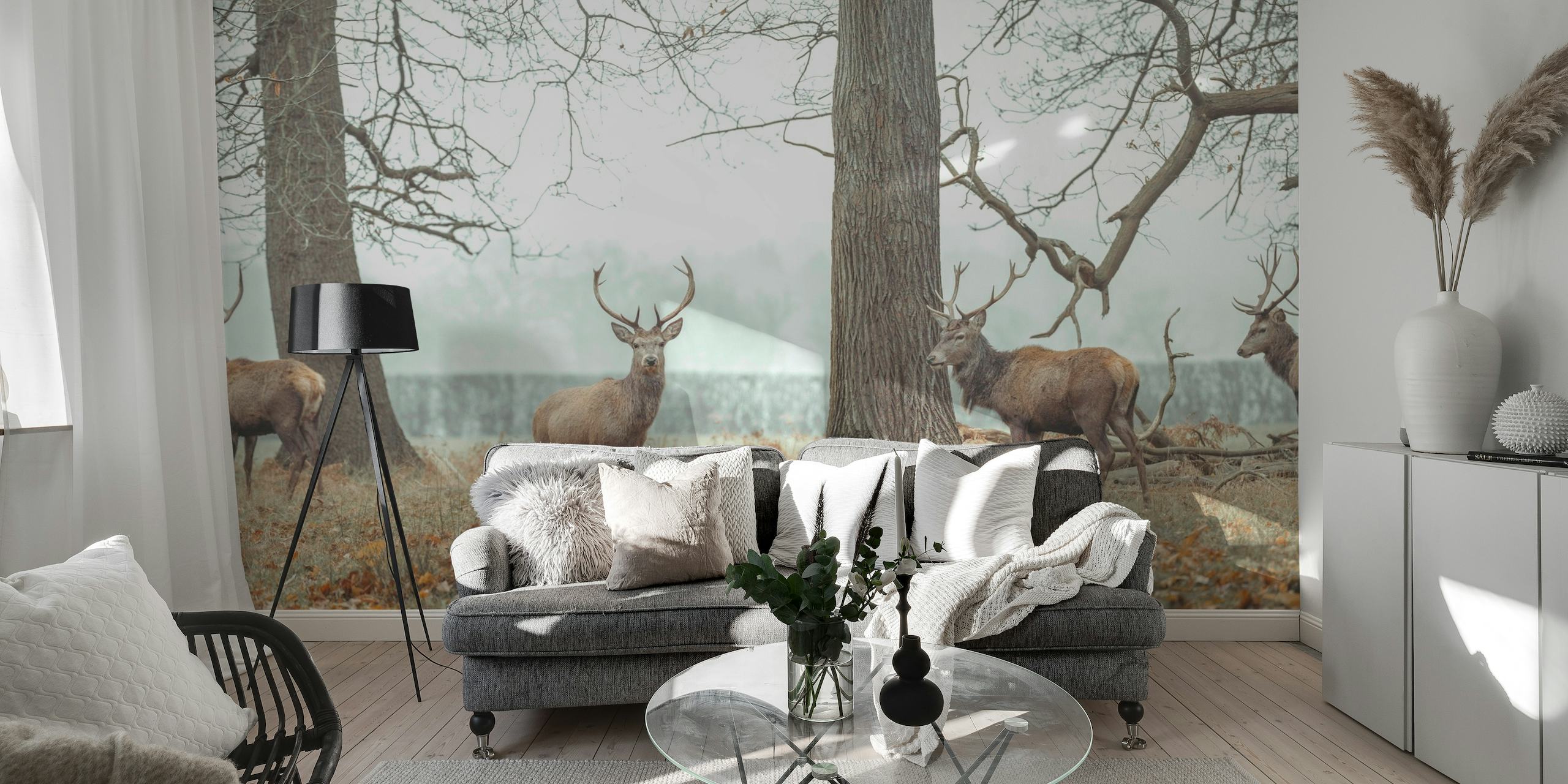 A wall mural showcasing stags standing in a serene, leafless forest, evoking a calm woodland atmosphere.
