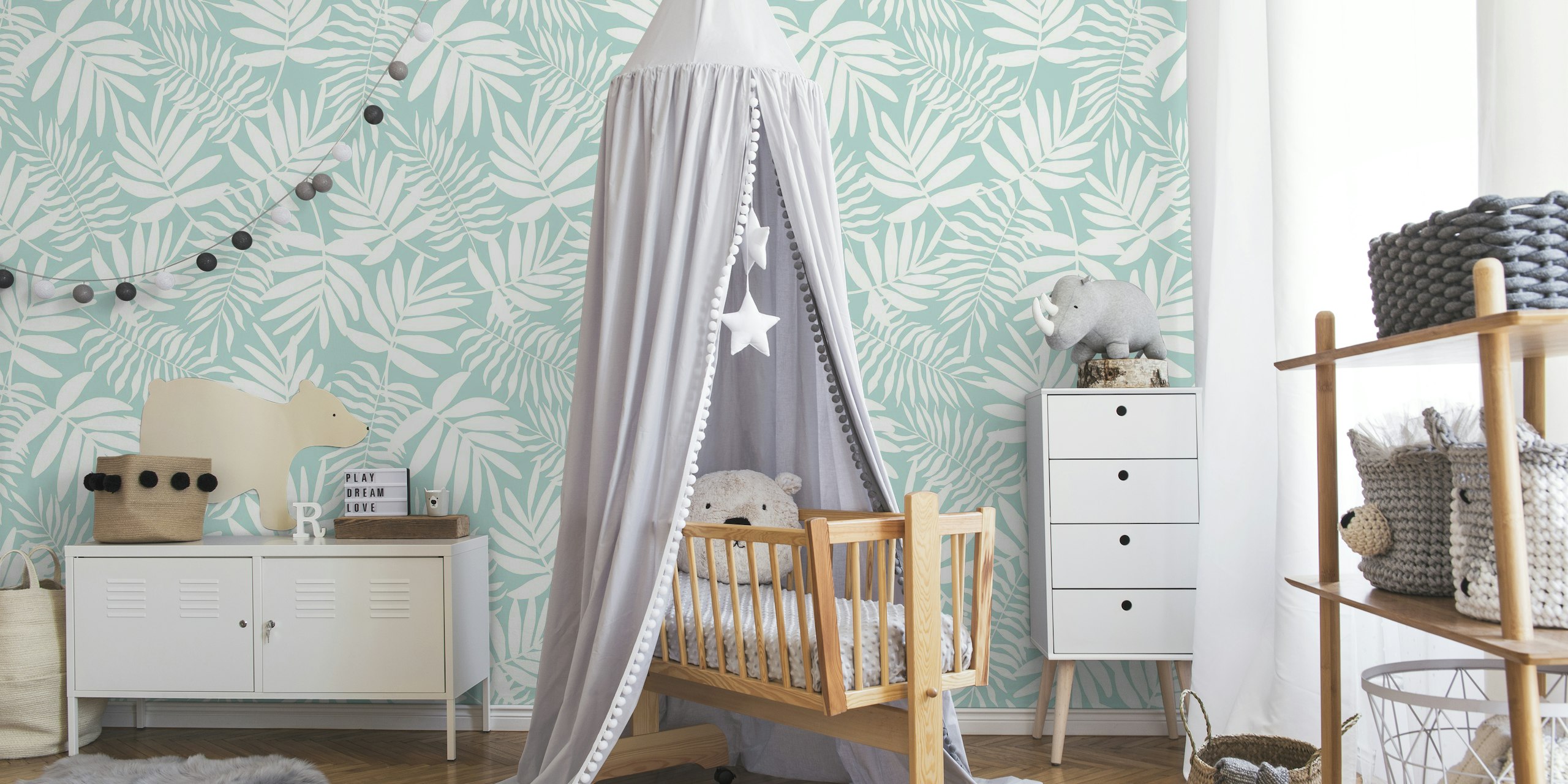 White palm leaves on baby blue tapete