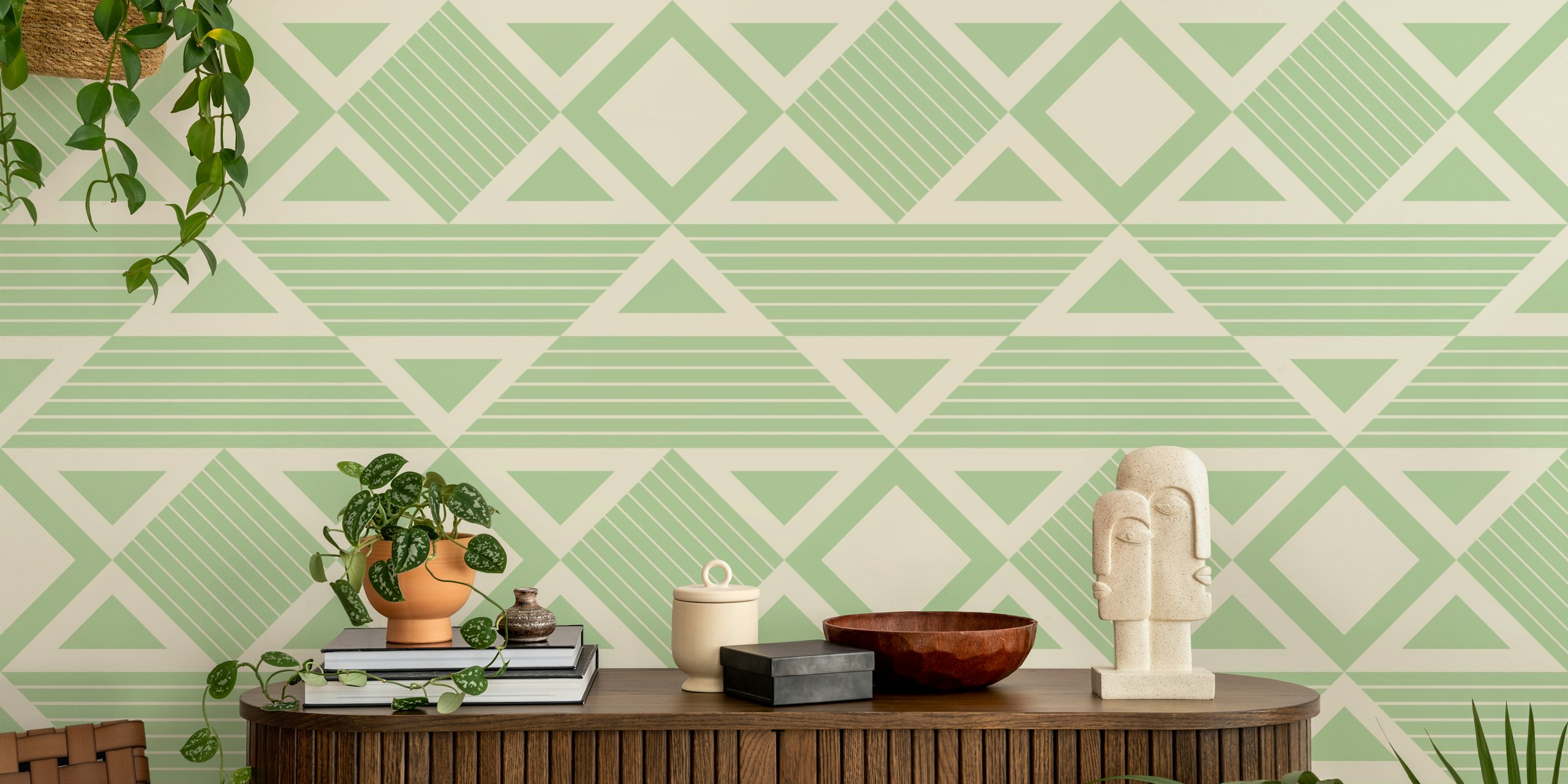 Green geometric tribal shapes on cream background wallpaper