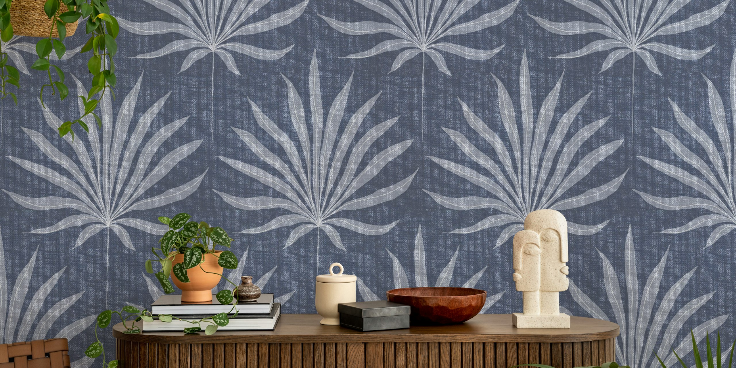 Denim blue palm frond wallpaper in a room