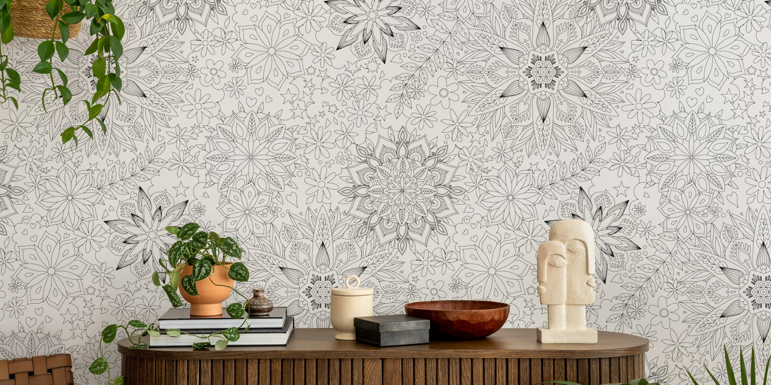 Floral mandala patterns in black and white wallpaper.