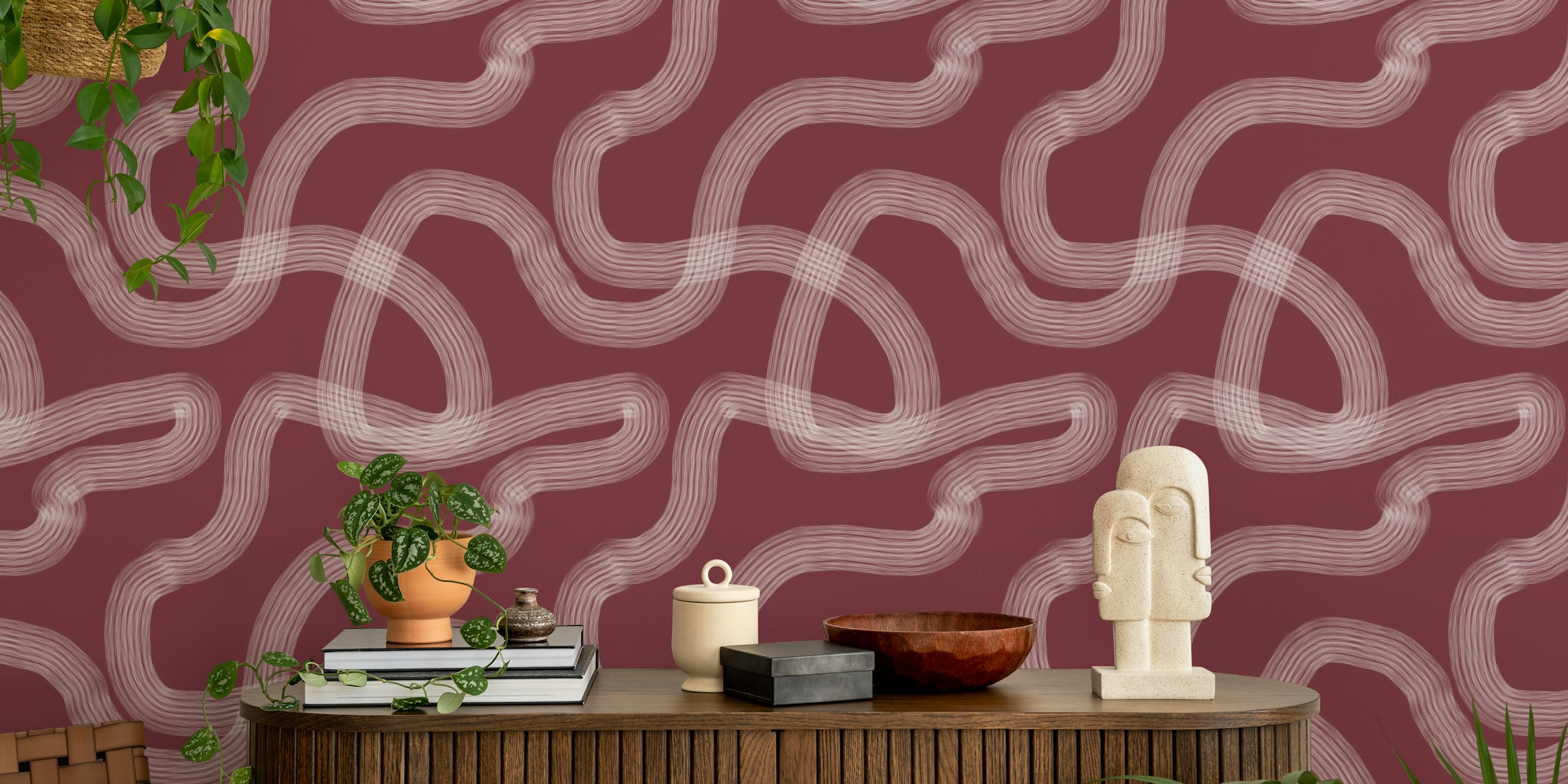 Abstract wavy brush strokes in white on a burgundy background wallpaper