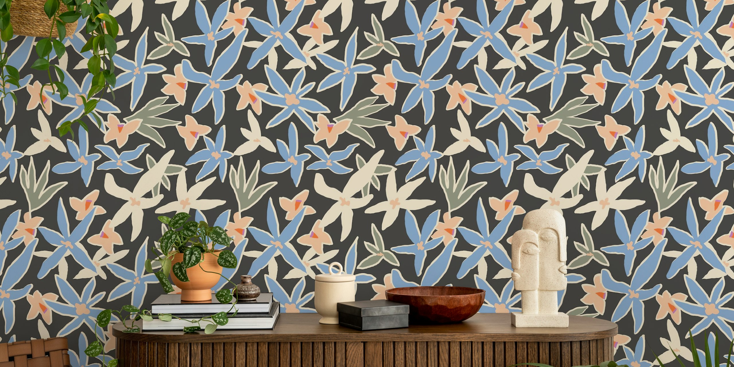 Decorative floral design in blue and peach on a black background wallpaper