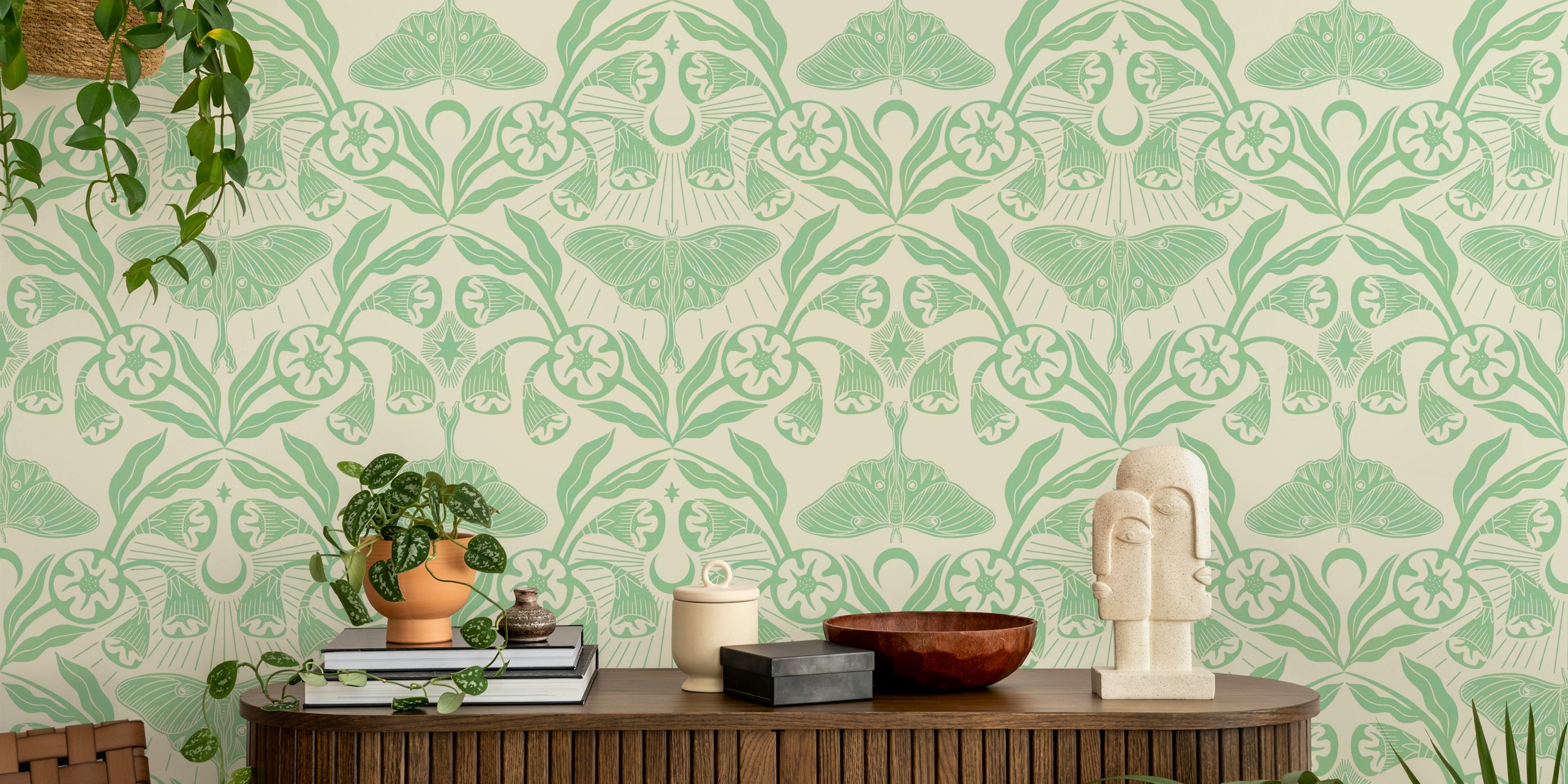 Luna moth and moonflowers in green floral wallpaper