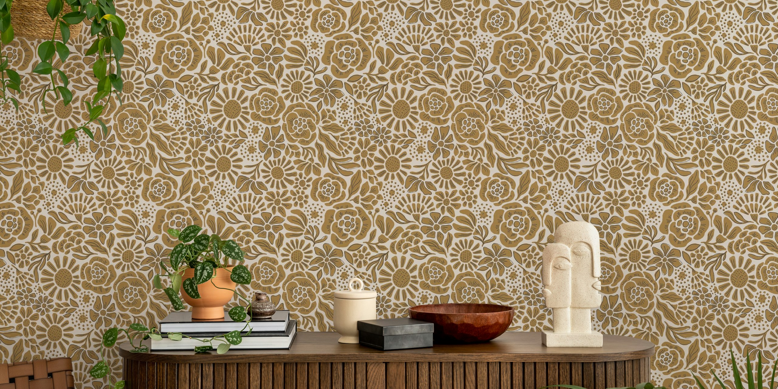 Gold floral pattern wallpaper with various flowers and leaves on a light background