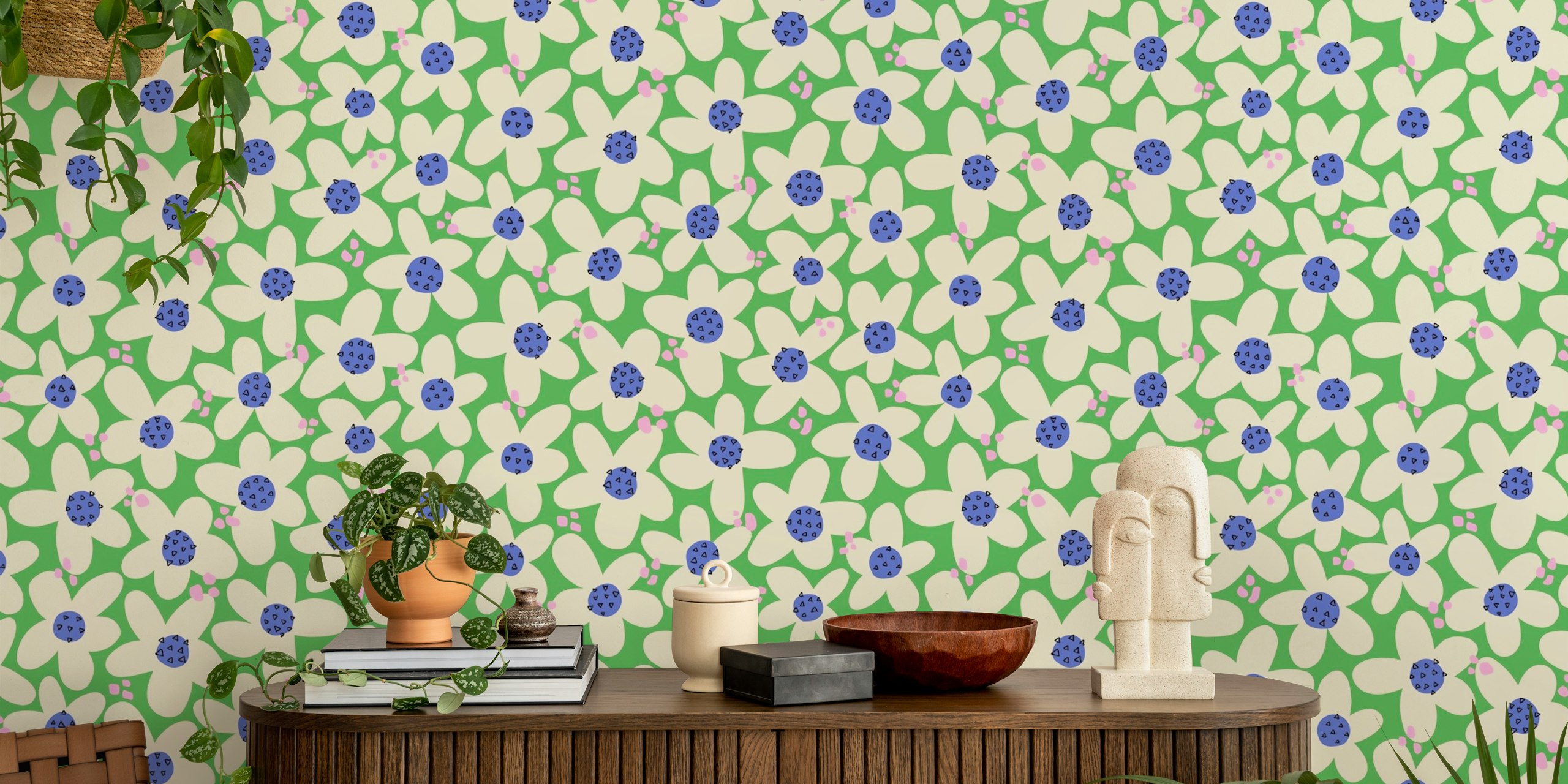 White hand drawn flowers with blue centers on green wallpaper
