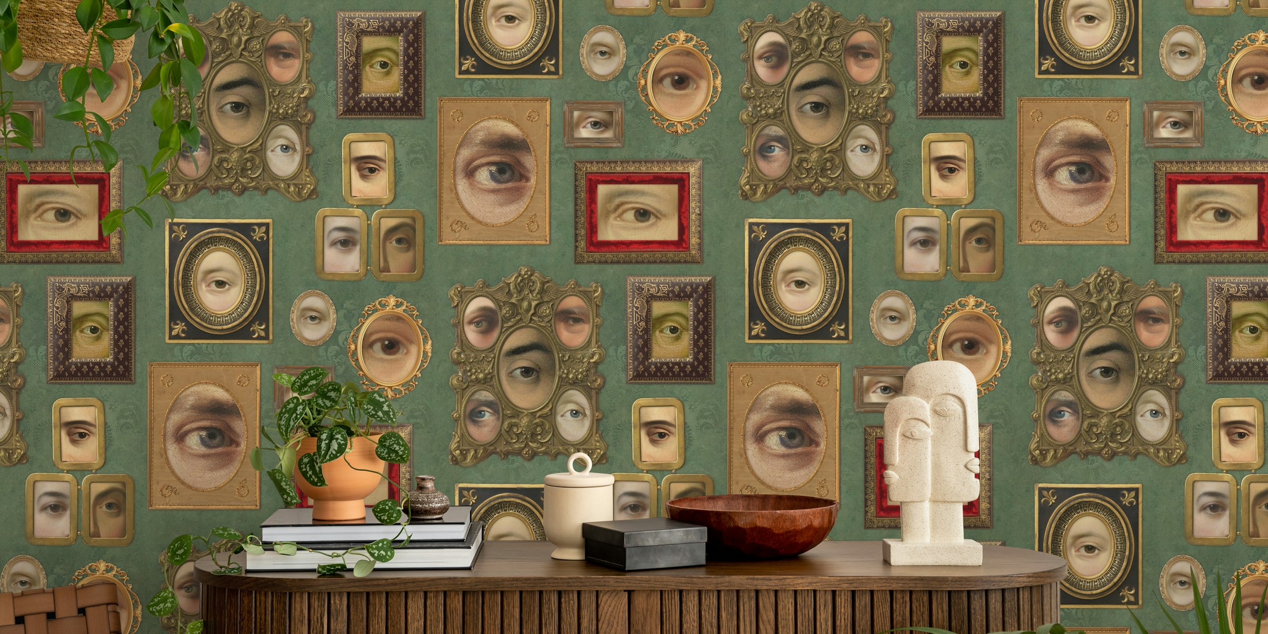 Multiple eye portraits in ornate frames on sage green wallpaper