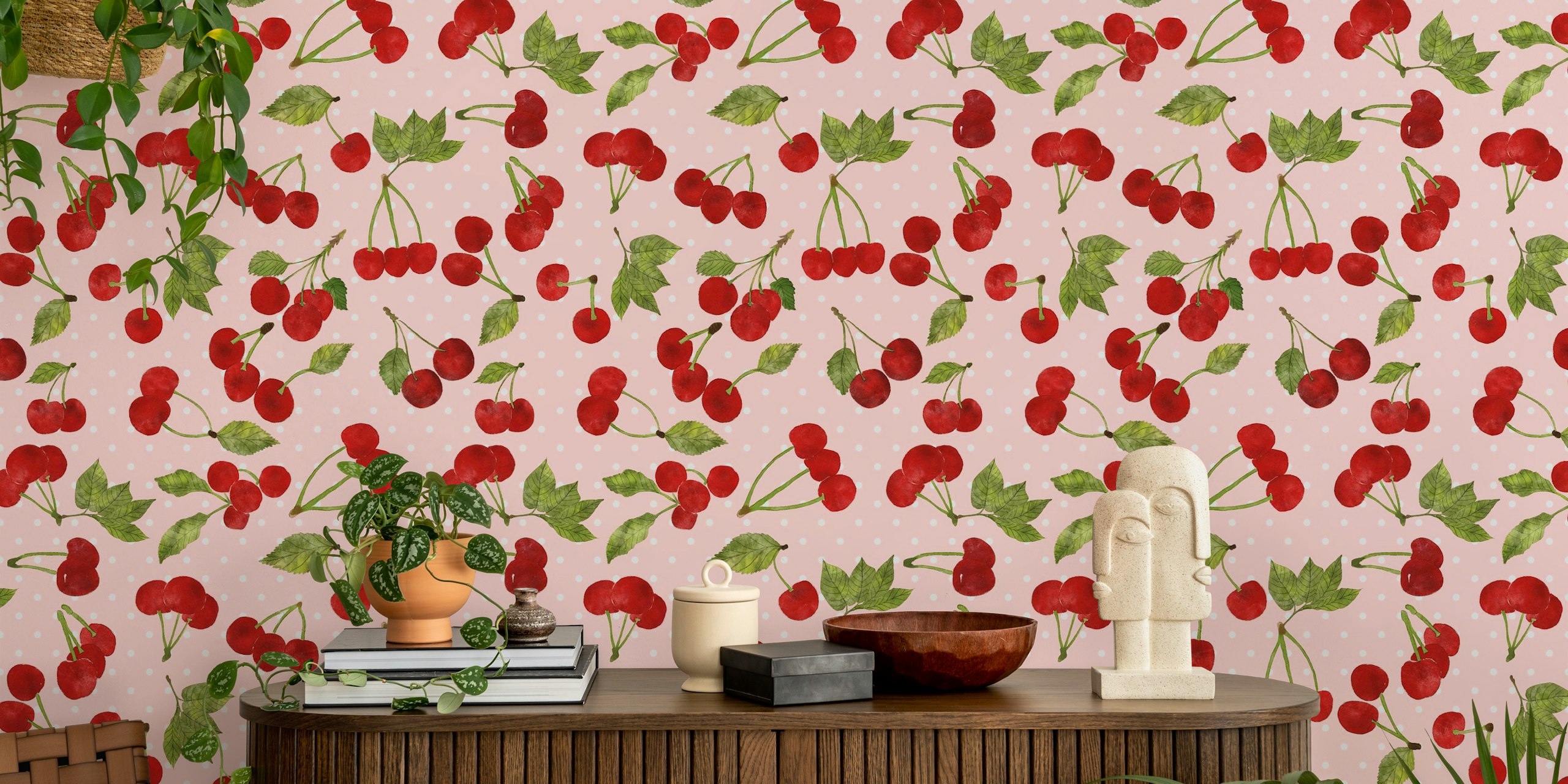 Ciliegie rosse con foglie verdi su un murale con sfondo a pois rosa