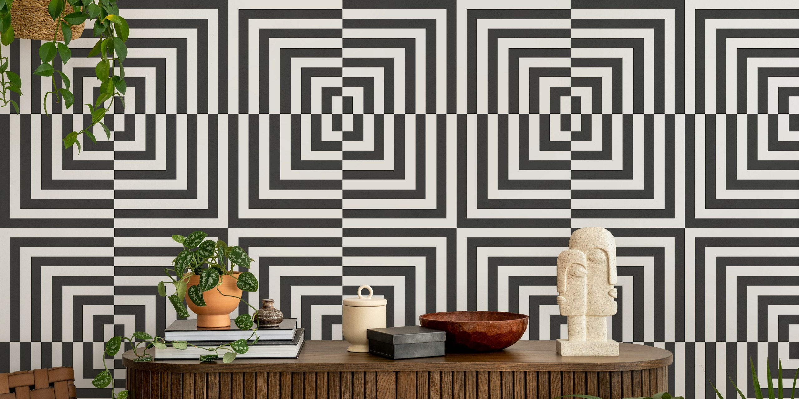 Black and white geometric striped wallpaper featuring concentric squares.